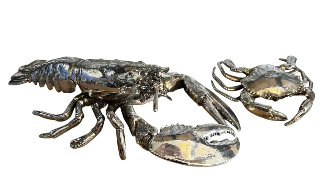 A pair of silver lobster and crab sculptures: A pair of silver lobster and crab sculptures