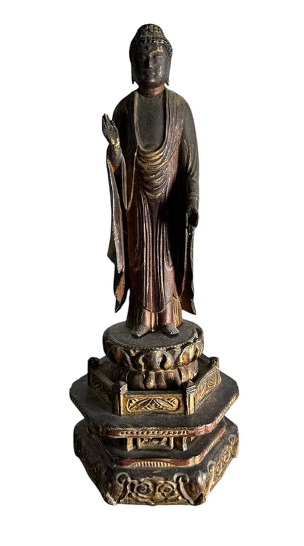 Antique Carved Wood Thai Buddha: An antique carved wood Thai Buddha, a graceful addition to a shelf, console, or meditation space. Dimensions: 5"W x 4"D x 12"H. This lot is offered with a reserve. All items ship. No local pickup and 