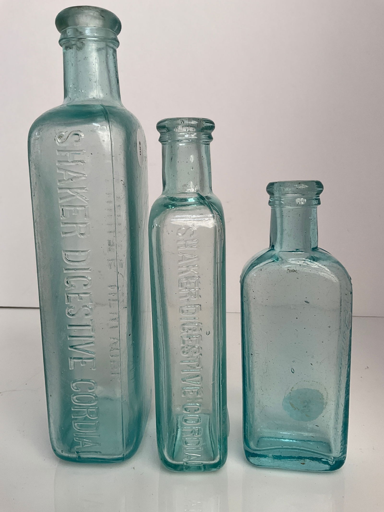 Lot of Three Different Sized Shakers Digestive Cordial Bottles from A.J. White, New York (1 of 5)