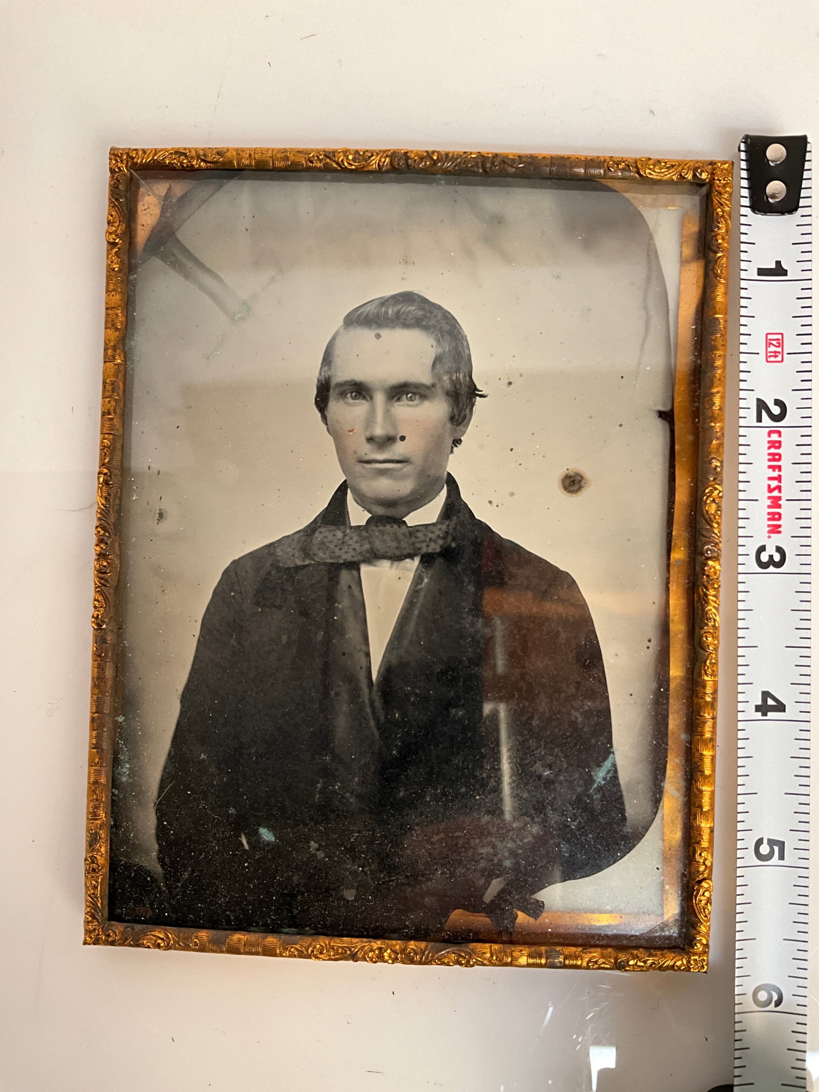 1850s or 60s Ambrotype quarter plate.: Here’s the 1950s or 60s Ambro type quarter plate. Seems to be in pretty fair condition but I don’t see any damage. The back is lacquered black. There is what appears to be some flaking off the ori