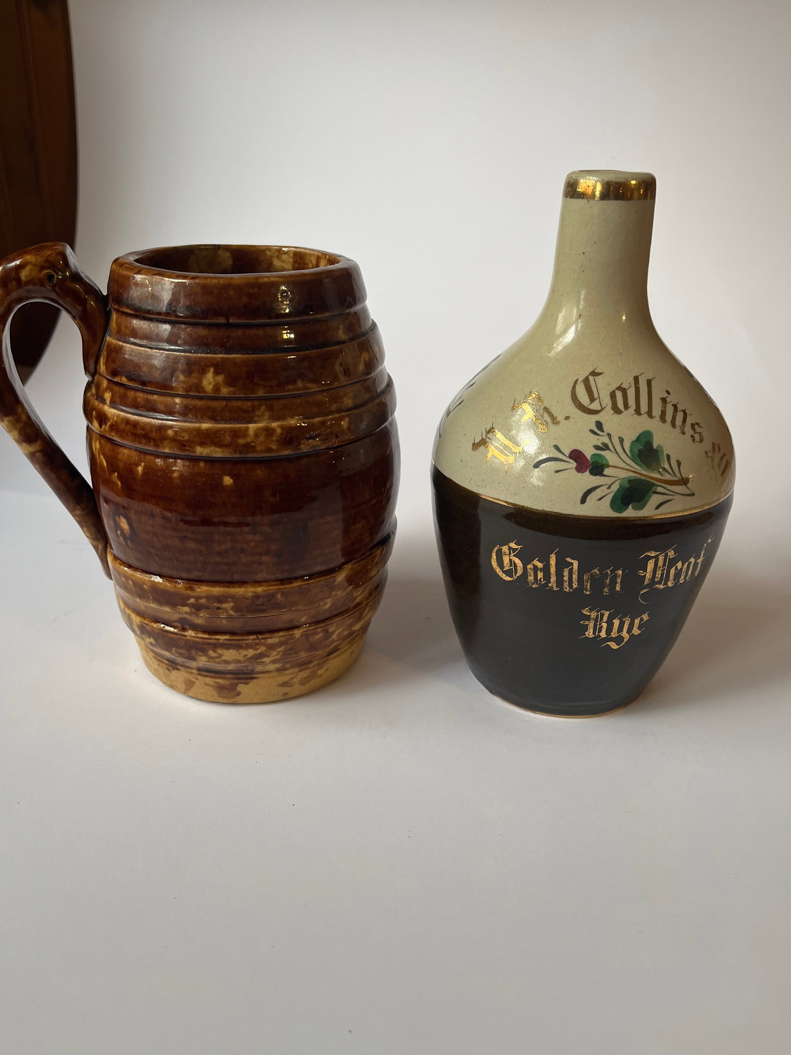 Lot of 2 stoneware items. A Fulper whiskey jug and a large barrel shaped mug. (1 of 6)