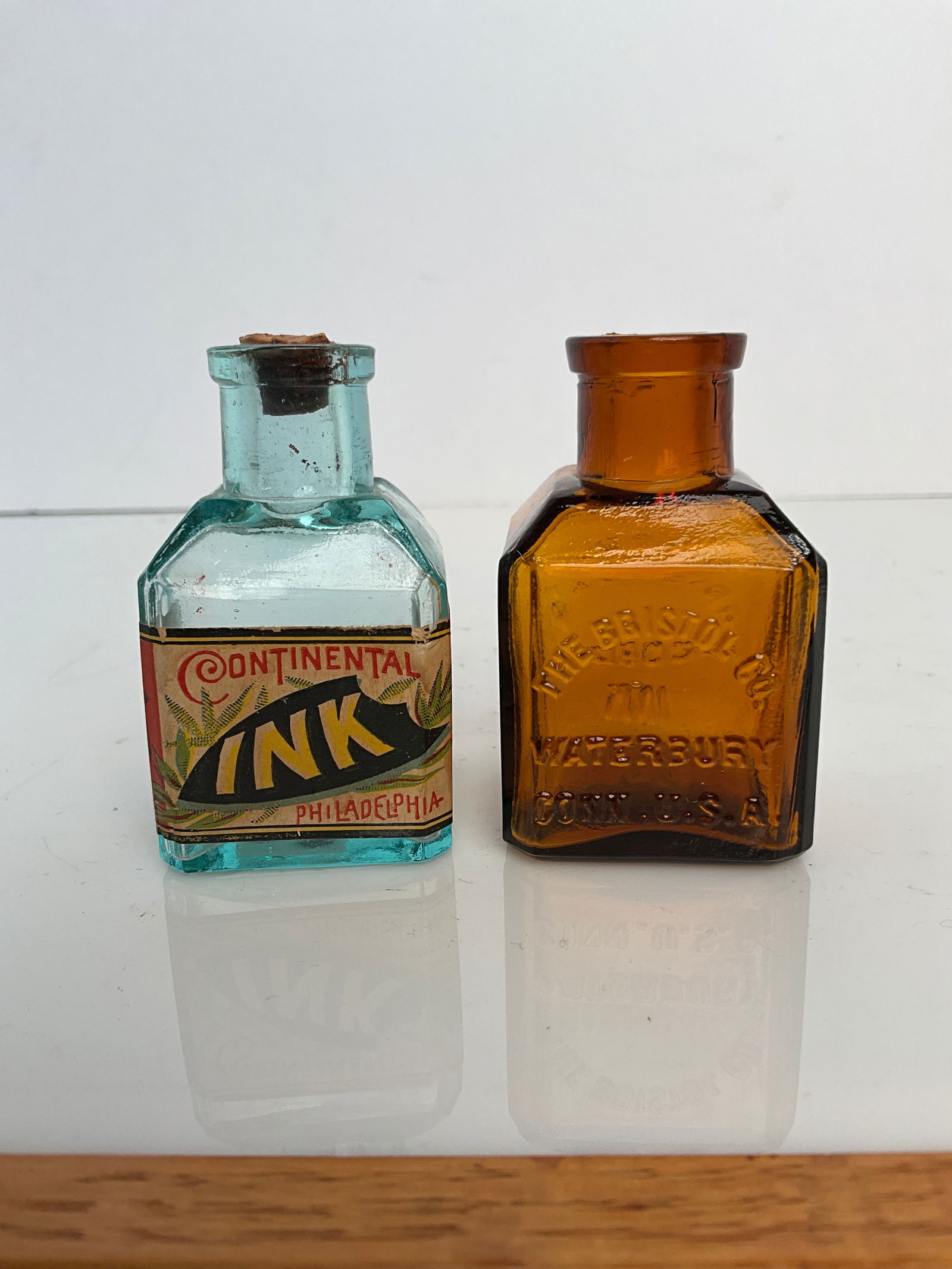 2 school house style Ink bottles, one amber and one with label (1 of 5)