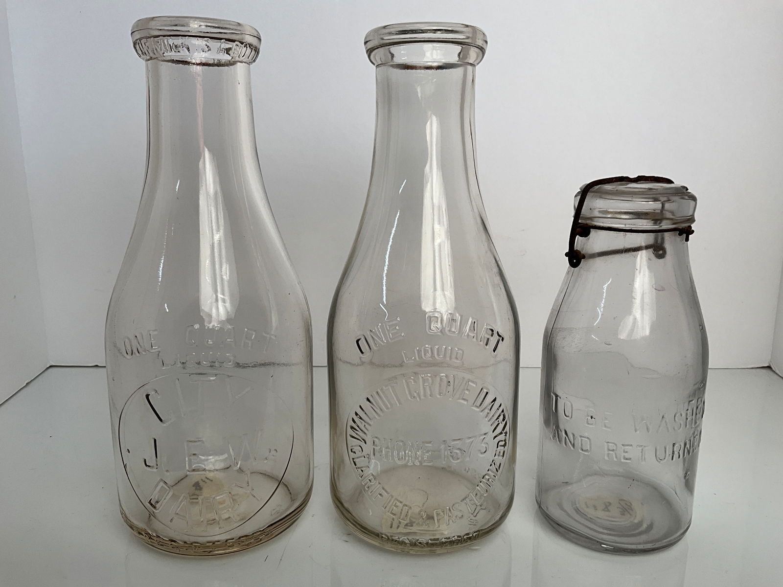 Three Embossed Milk Bottles (1 of 7)