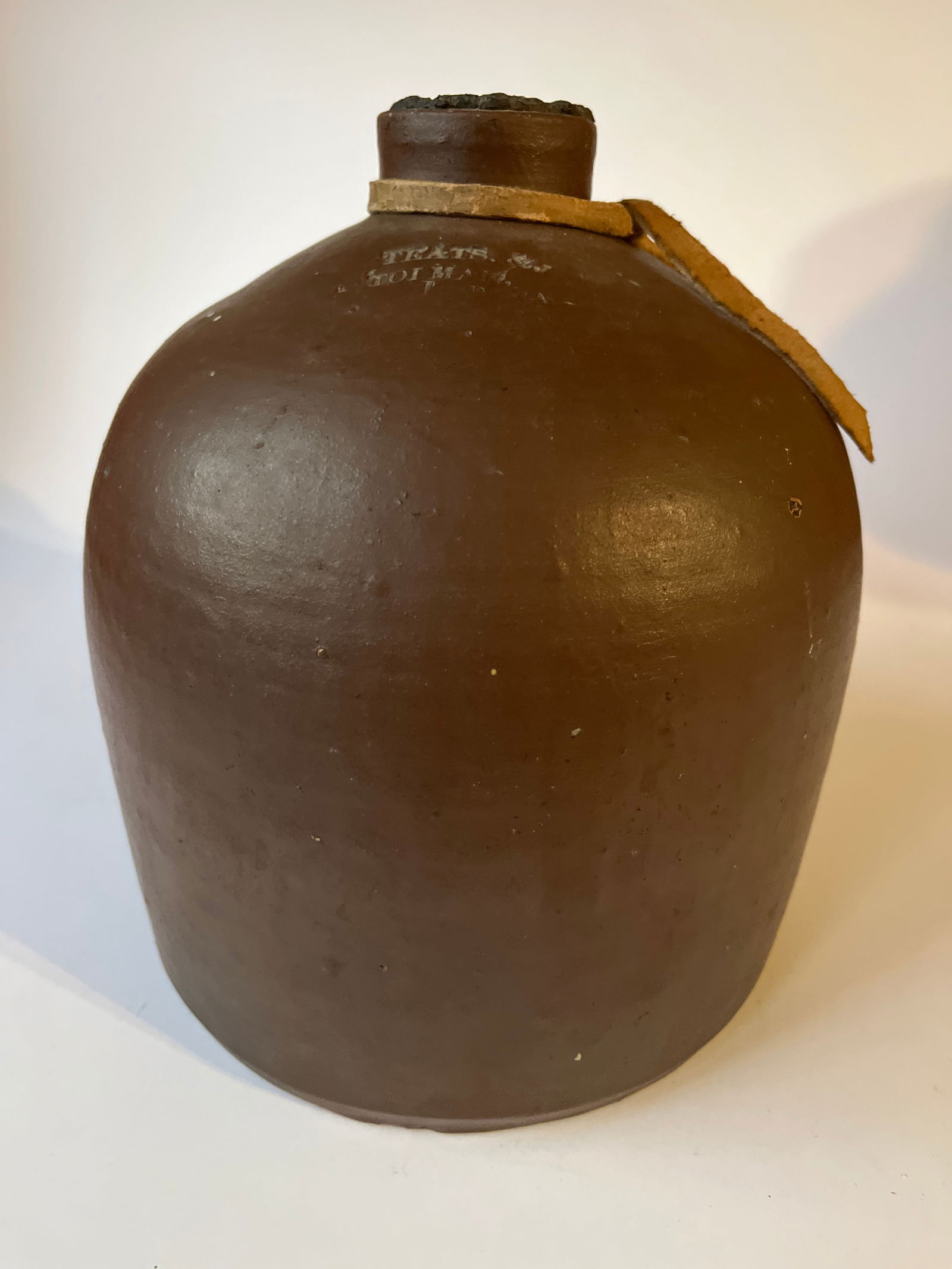 TEATS & TOLMAN stamped stoneware jug. Possibly Iowa. (1 of 5)