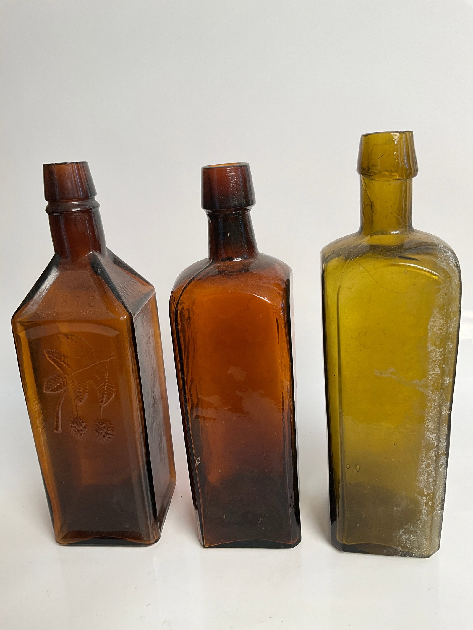 2 unembossed bitters, one Amber, one Olive Green and the Doyle’s hop bitters: 2 unembossed bitters, one Amber, one Olive Green and the Doyle’s hop bitters. The Amber Square unembossed bitters is full of whittle, wild the olive green one is just a really neat color. The amber 