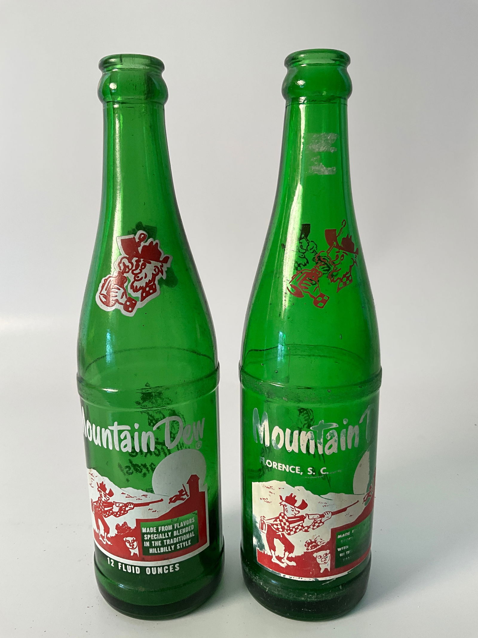 Lot of two Hillbilly Moutain Dew Bottles with red Hilbilly (1 of 5)