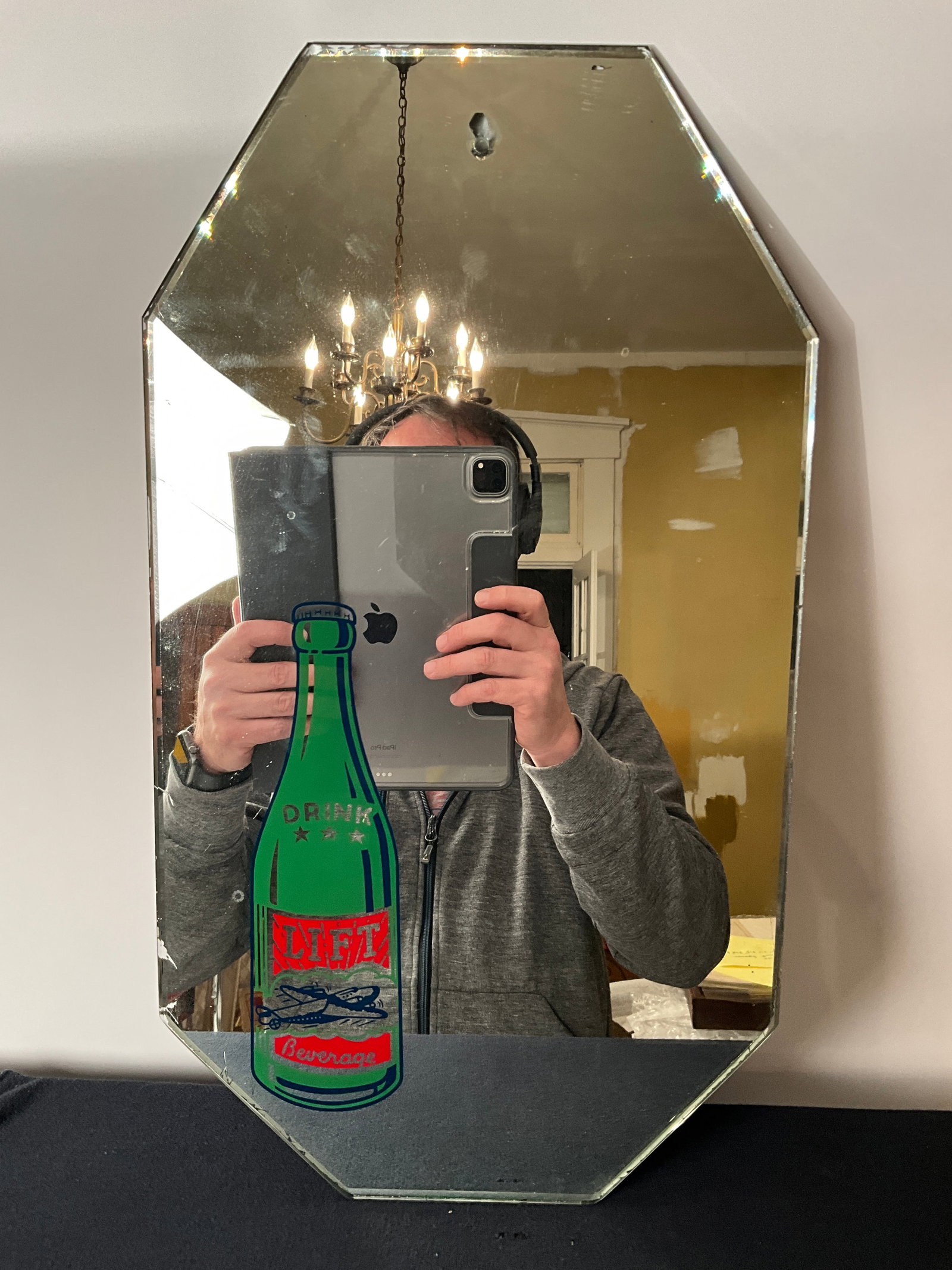 Lift Beverage Advertising Mirror with Airplane Logo on the Bottle: Lift Beverage mirror advertisement. Great shape for its age! This is a difficult four-cut corner mirror to find. Heavy. Does have some wear in the mirror. Measures 10" by 18".