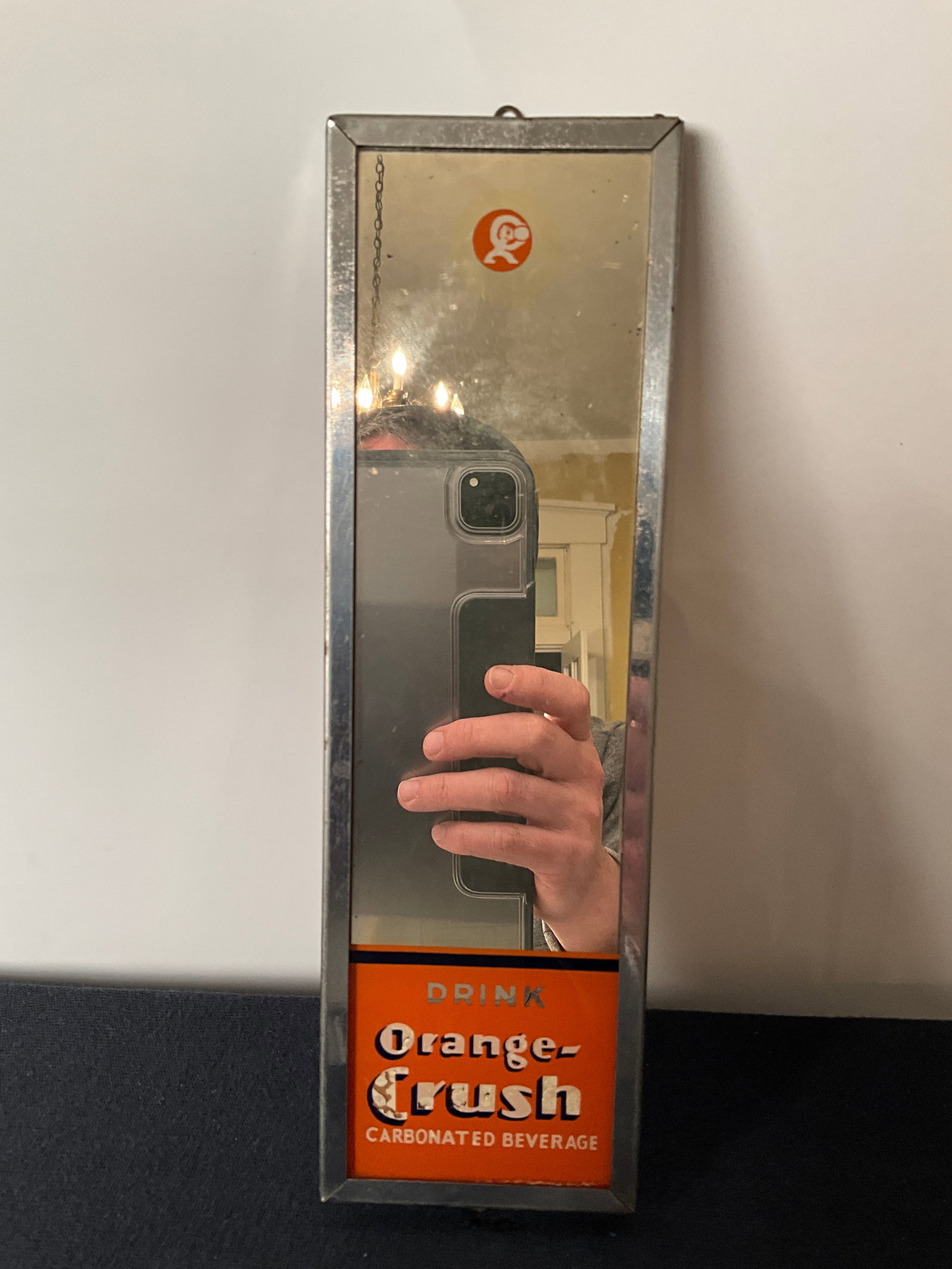 Drink Orange Crush Carbonated Beverage Reverse on Glass Advertising Mirror: Orange Crush mirror. Neat piece. Measures 10" by 3". Deglazing on some of the lettering.