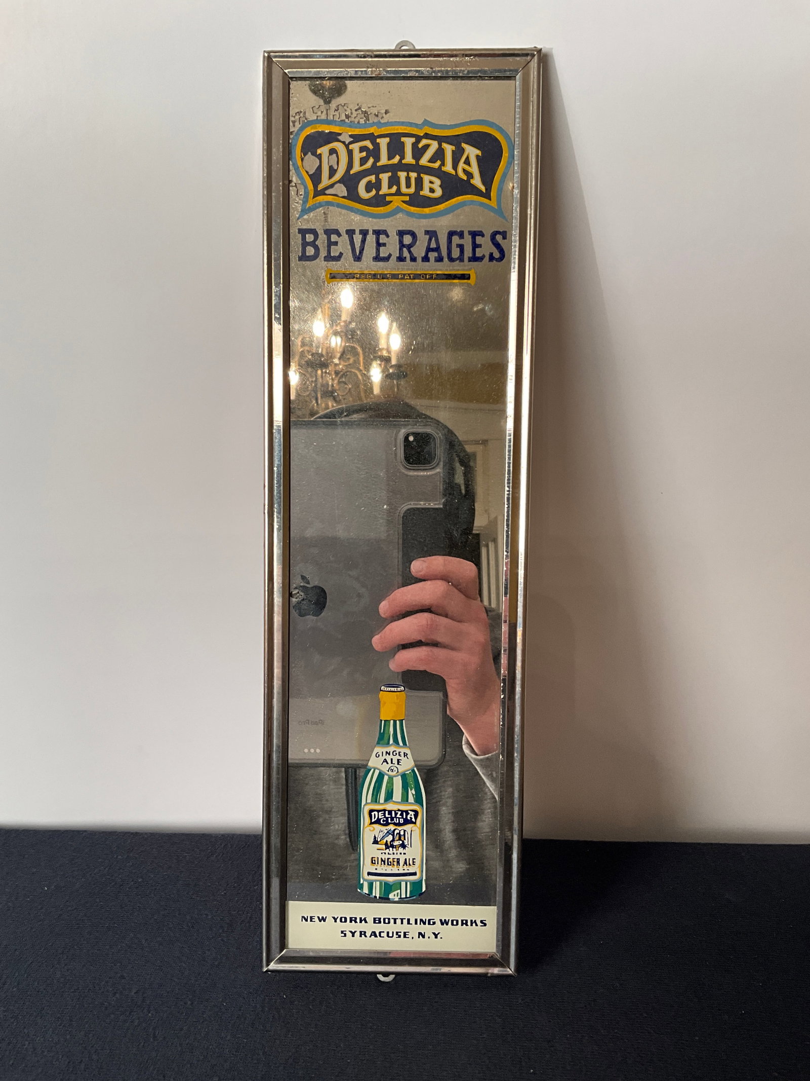 Delizia Club Beverages Reverse on Glass Advertising Mirror: Delizia Club Beverages reverse on glass advertising mirror. Delizia Club Ginger Ale bottle on the glass mirror. Good condition. Measures 4" by 14".