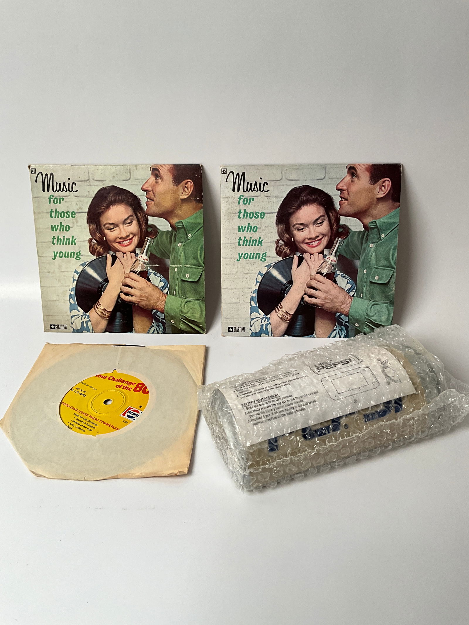 2 1960s Pepsi Vinyl Record Sleeve, 1 Pepsi Challenge 45 from the 80s and 1 NOS Pepsi Door Device (1 of 5)