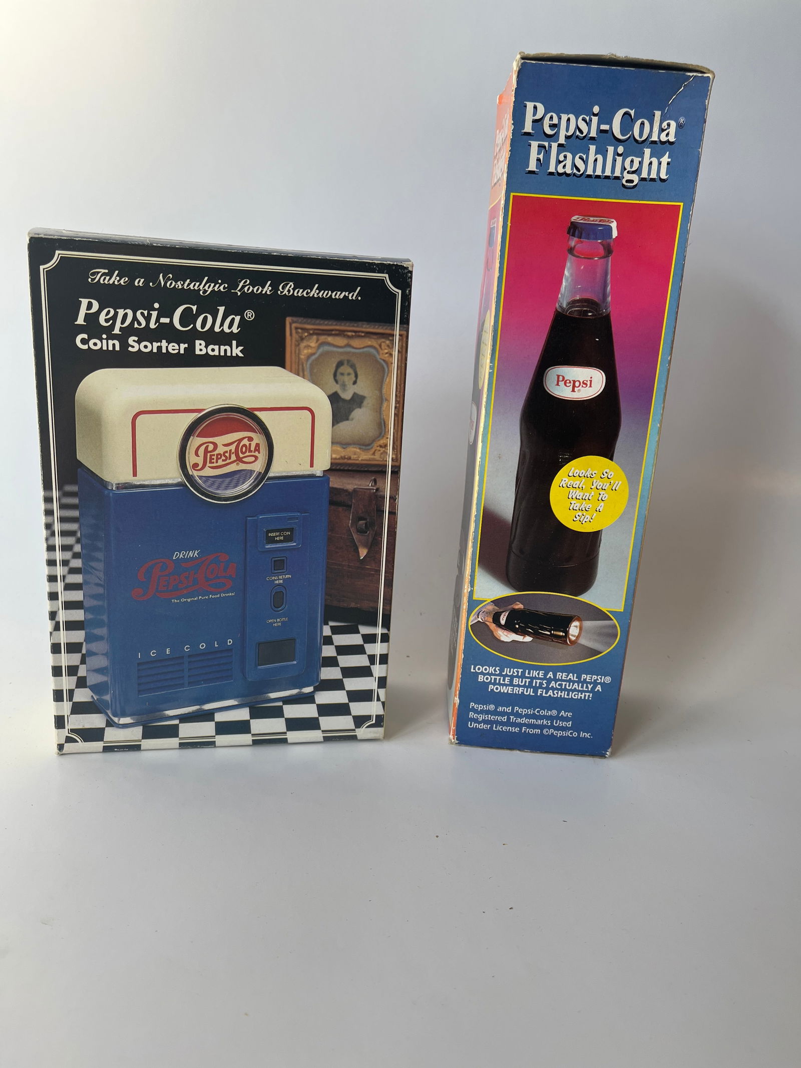 Lot of 2 Pepsi Collectibles. A coin sorter bank and a Pepsi bottle flashlight. Both new in box. (1 of 3)