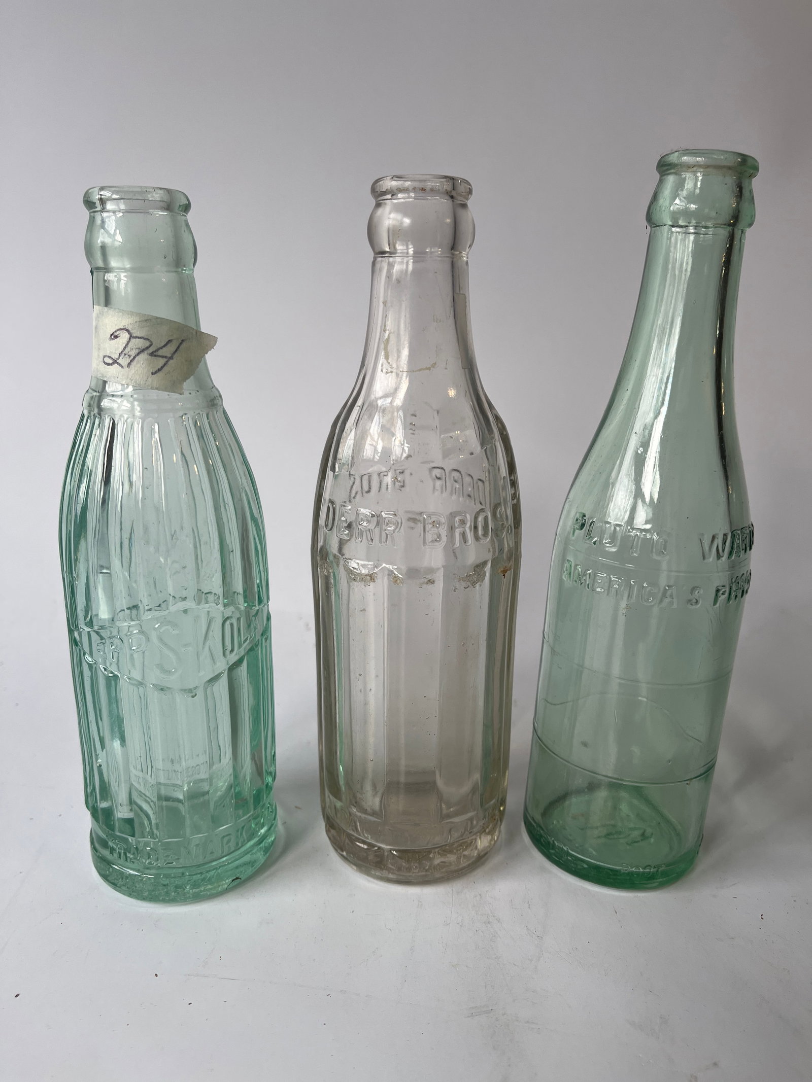 Lot of 3 sodas. An Epps-Kola, Derr Bros and a Pluto Water w embossed devil.: Lot of 3 sodas. An Epps-Kola, Derr Bros and a Pluto Water w embossed devil. No damage.