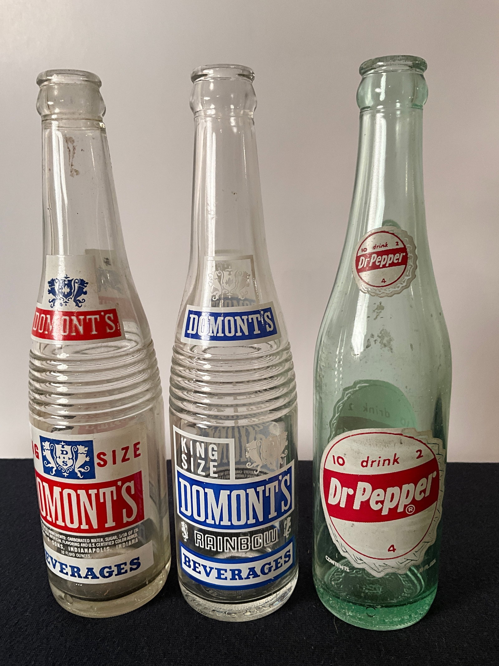 Lot of 3 ACL Pop Bottles, 2 Domont's from Indianapolis and Dr. Pepper: Lot of 3 ACL Pop Bottles, 2 Domont's from Indianapolis and Dr. Pepper. Two different Domonts King Size bottles, one in a 2 color, Red and White. The other in a 3-color red, white and blue. Indianapoli