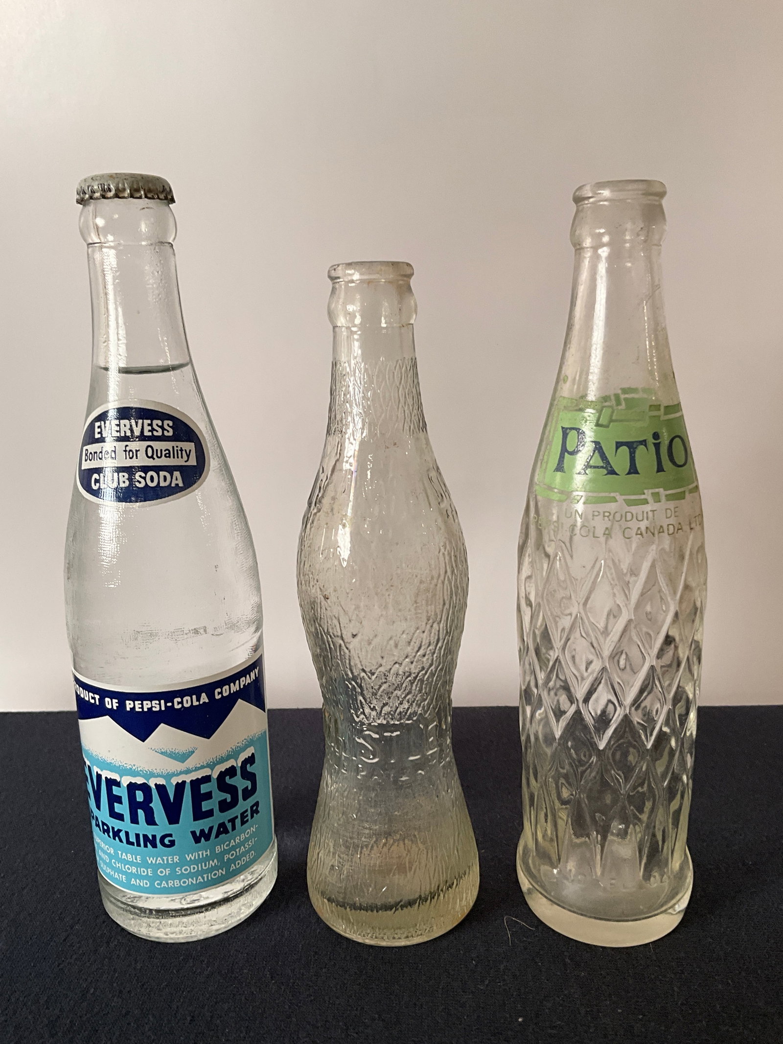 Lot of 3 ACL Pop Bottles, Evervess by Pepsi, Patio by Canada Pepsi, and Whistle: Lot of 3 ACL Pop Bottles, Evervess by Pepsi, unopened Super nice and appears un-used, Patio by Canada Pepsi, and Whistle, Baltimore, art deco shaped bottle. All bottles are in great shape no damage.