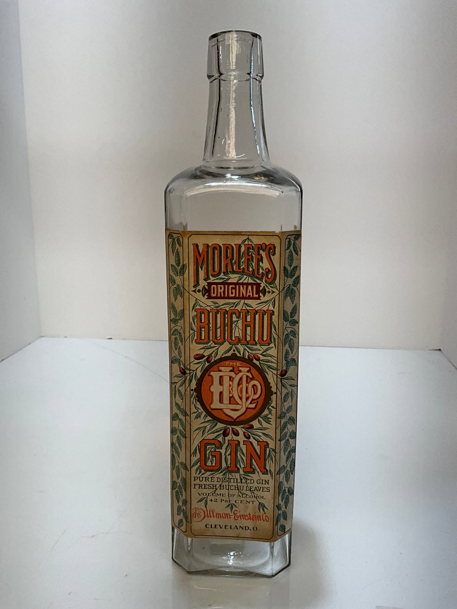Morlee’s Buchu Gin, with the Original Label which is 100%, The Ullman-Einstein Co. Cleveland Ohio: Morlee’s Buchu Gin, with the Original Label which is 100%, The Ullman-Einstein Co. Cleveland OhioAn early 1900's bottle with a tooled top. Bottle is clear and MINT with full 3 sided label which is a