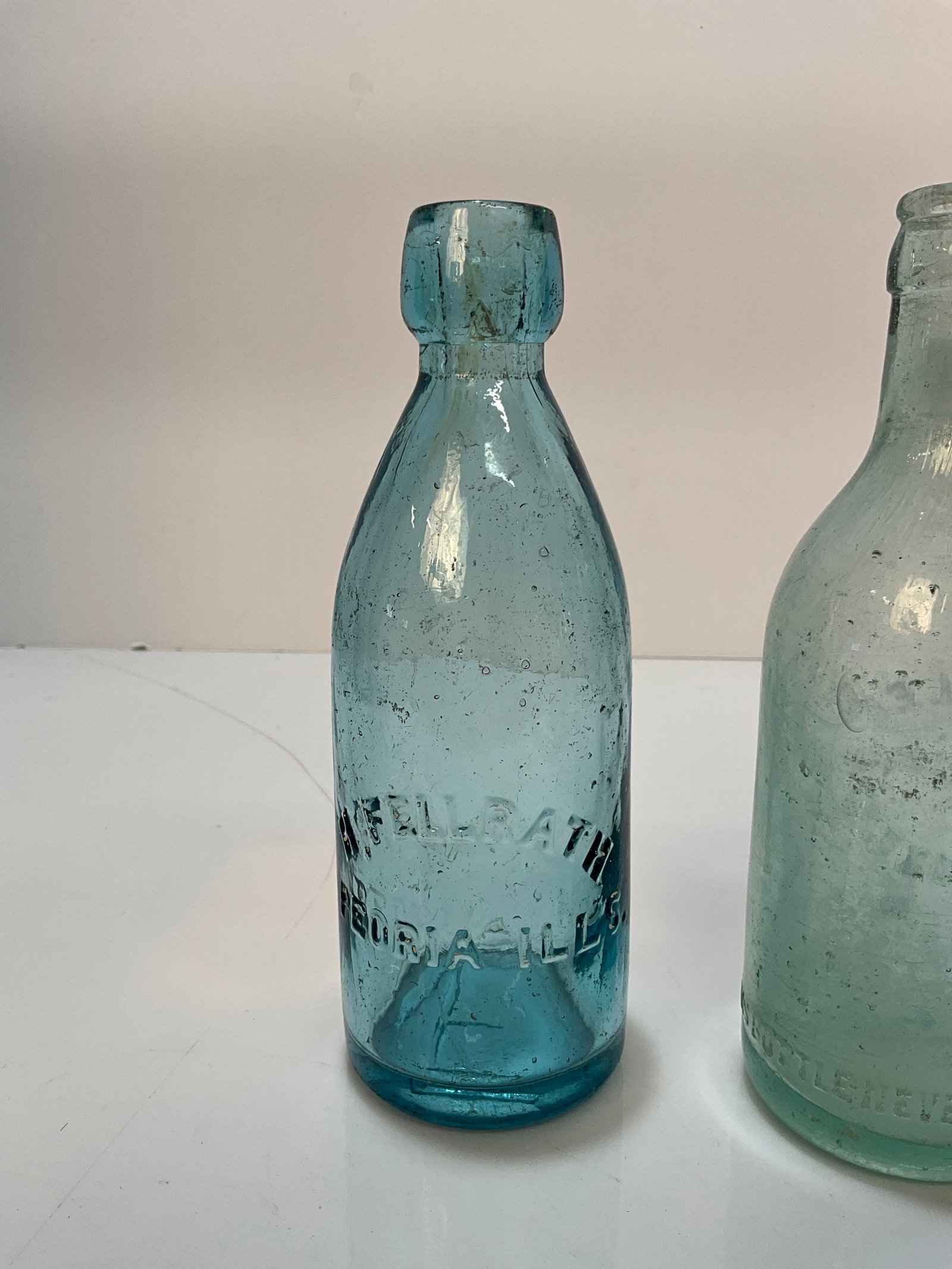 1870's H. Fellrath Blob Soda from Peoria, Ills. Cornflower Blue: 1870's H. Fellrath blob soda from Peoria, Ills. It is cornflower blue in color. There is an amber streak in the lip that adds to the beauty of this bottle. There us a large "F" embossed on the base of