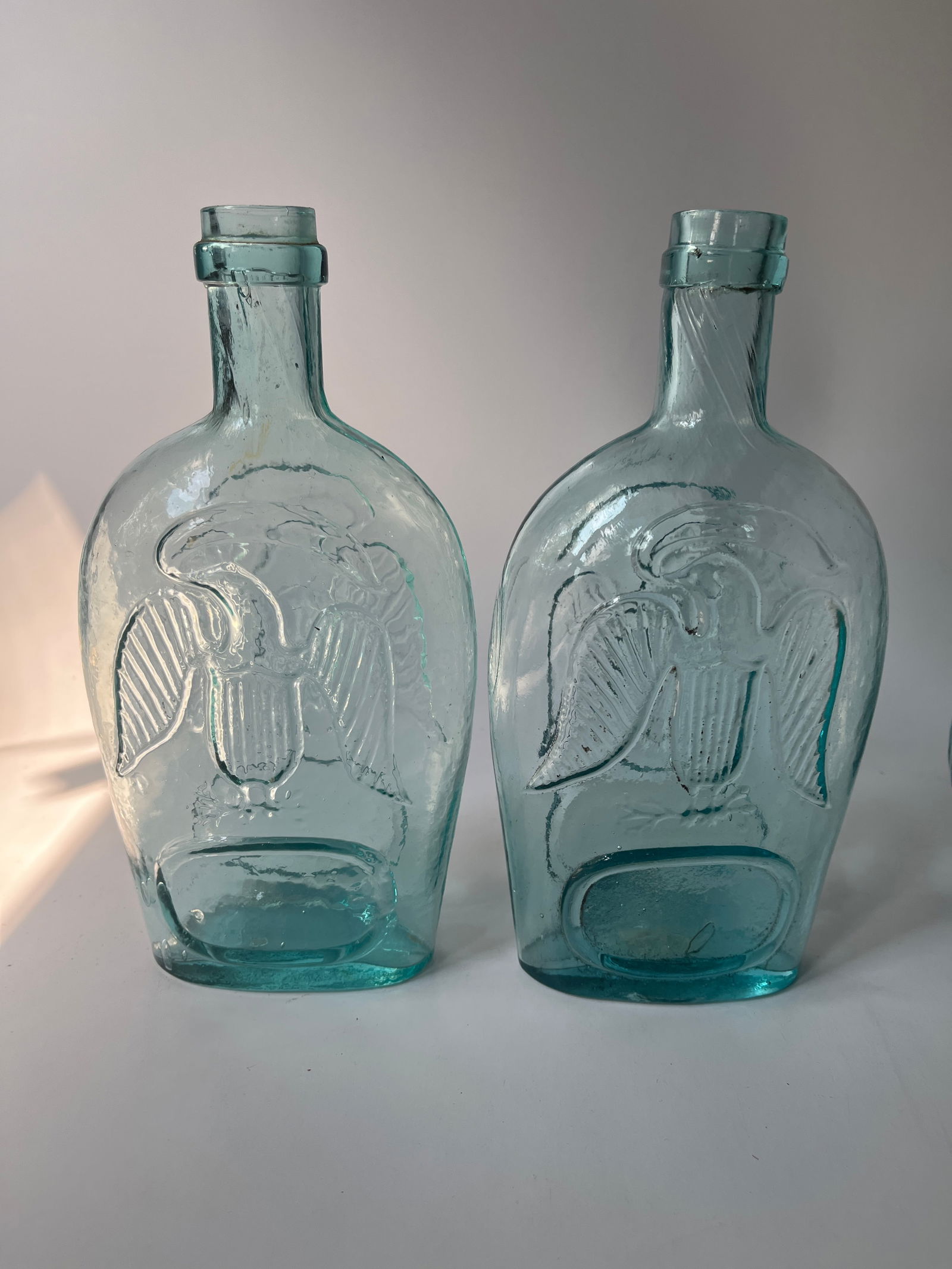 Lot of 2 Pint Aqua Double Eagle Flasks: Here's a nice set of 2 pint aqua Double Eagle flasks. The flasks are virtually identical and look great together. Both have great strikes and have no damage.