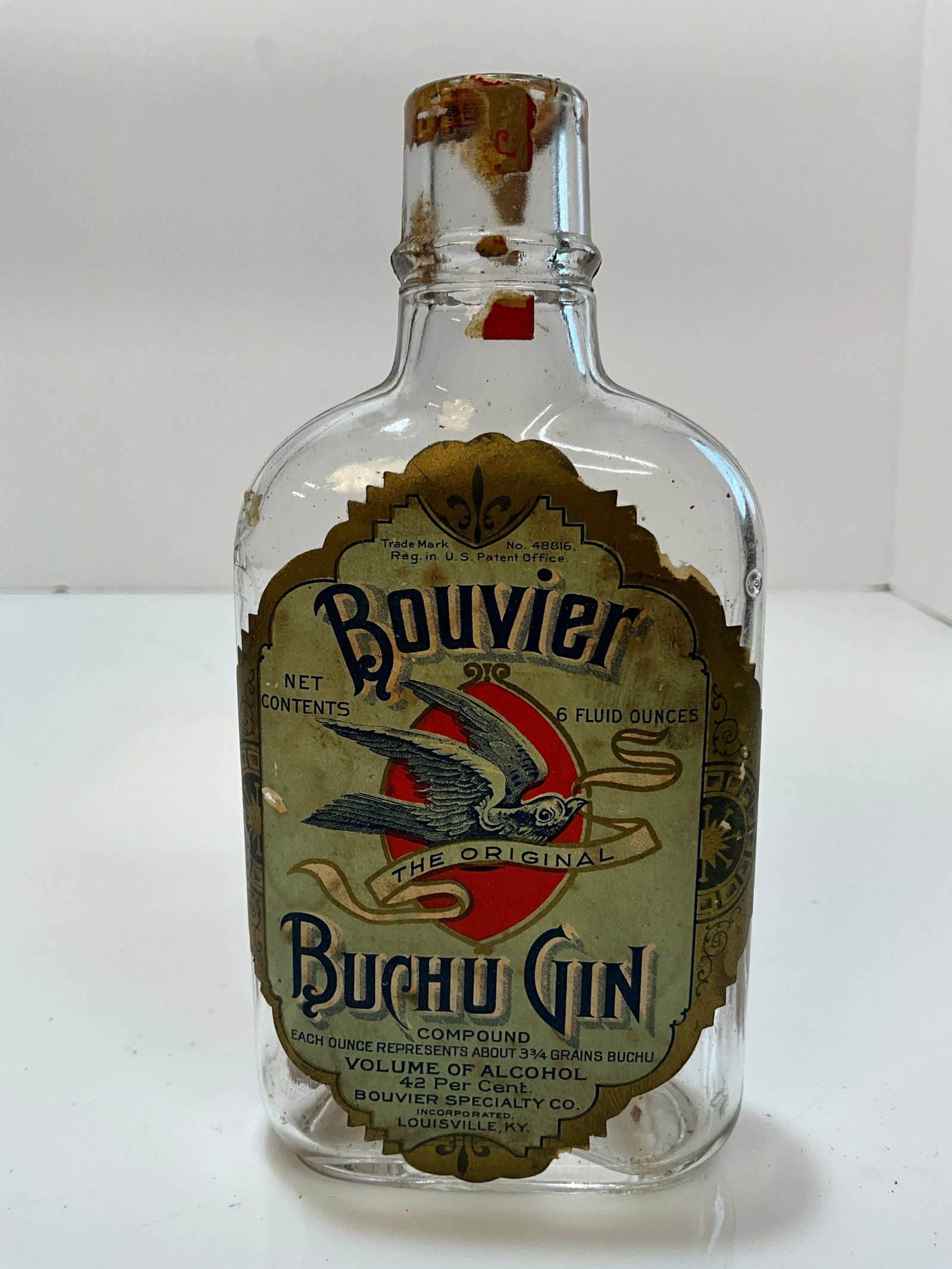 Bouvier Buchu Gin Bottle with both F/B Labels - Very Colorful - Louisville Kentucky: Bouvier Buchu Gin Bottle with both F/B Labels - Very Colorful. A machine made bottle with both the front and reverse labels. No damage on the bottle and both labels appear to be complete. A must have 