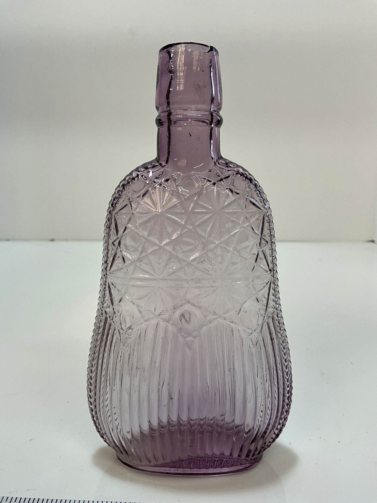1/2 Pint flask with fancy pattern, amethyst colored (1 of 4)