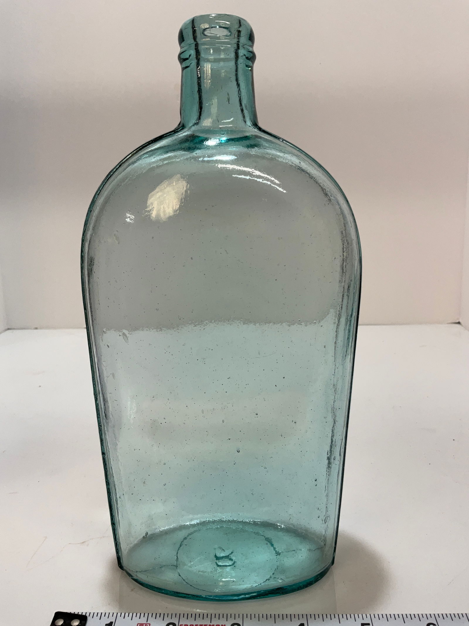 Aqua Strap Sided Quart Flask, with Tooled Lip, Embossed with an "R" on the base.: Aqua Strap Sided Quart Flask, with Tooled Lip, Embossed with an "R" on the base. Clean and shelf ready bottle