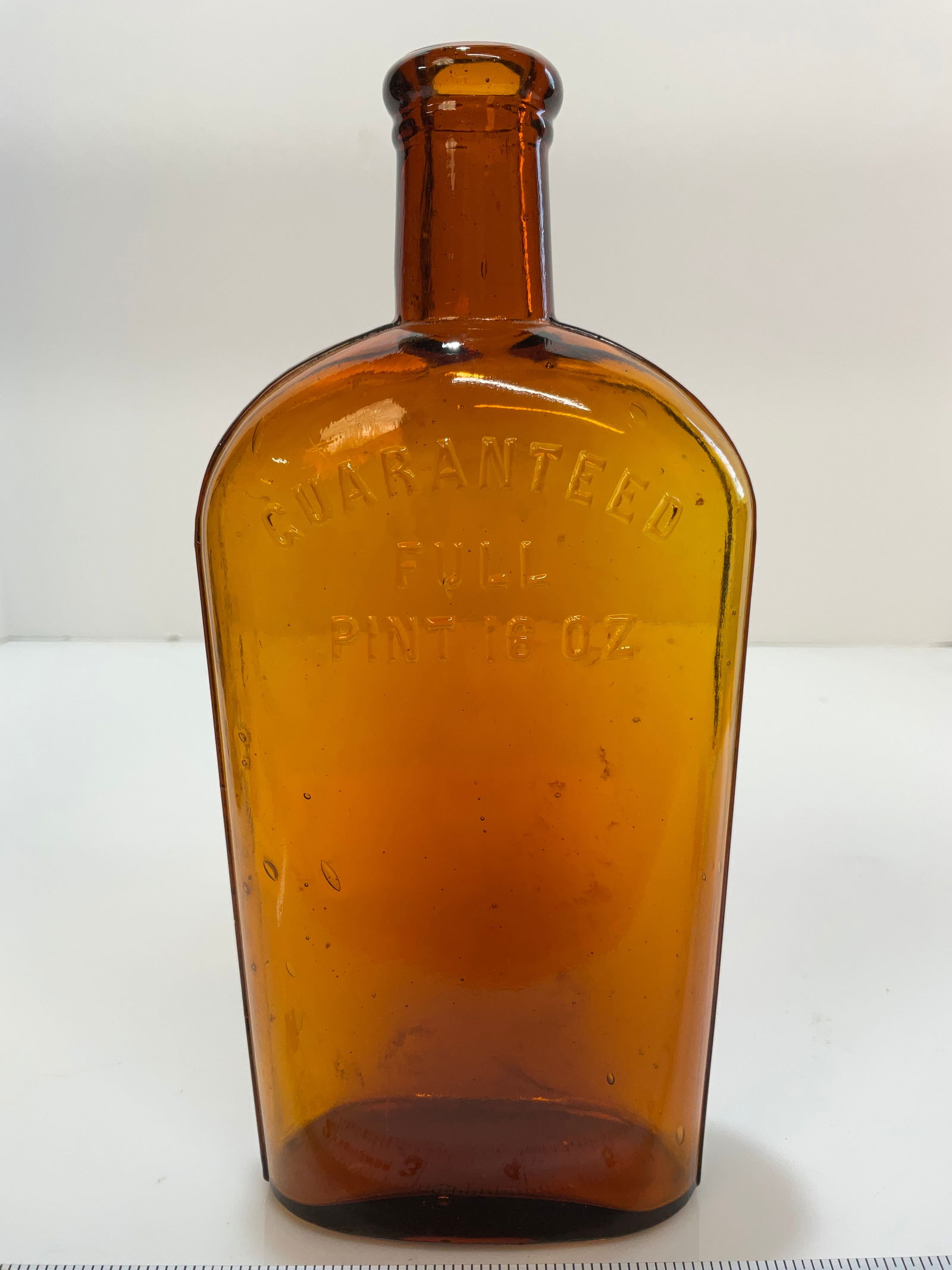 Amber Pint Strap Sided Flask, Tooled Lip embossed " Guaranteed Full Pint 16 oz. (1 of 6)