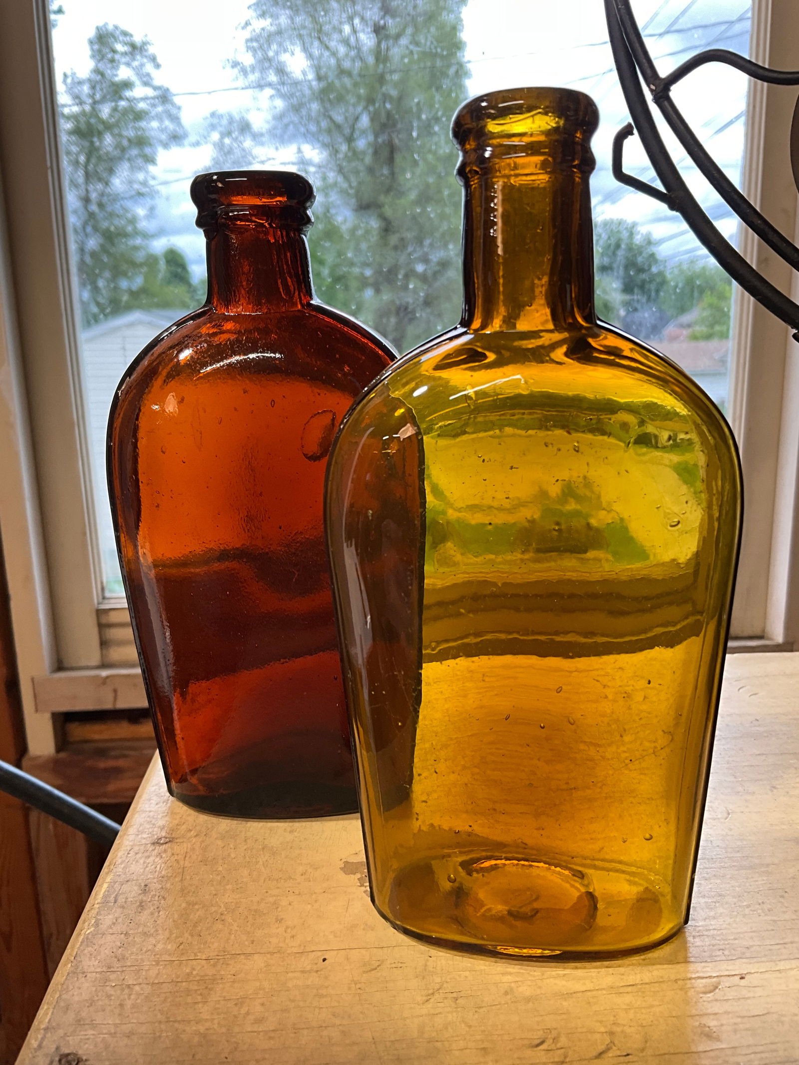 Two - Amber 1/2  Pint Strap Sided Flask. Tooled Lip. One Darker and one Lighter (1 of 6)