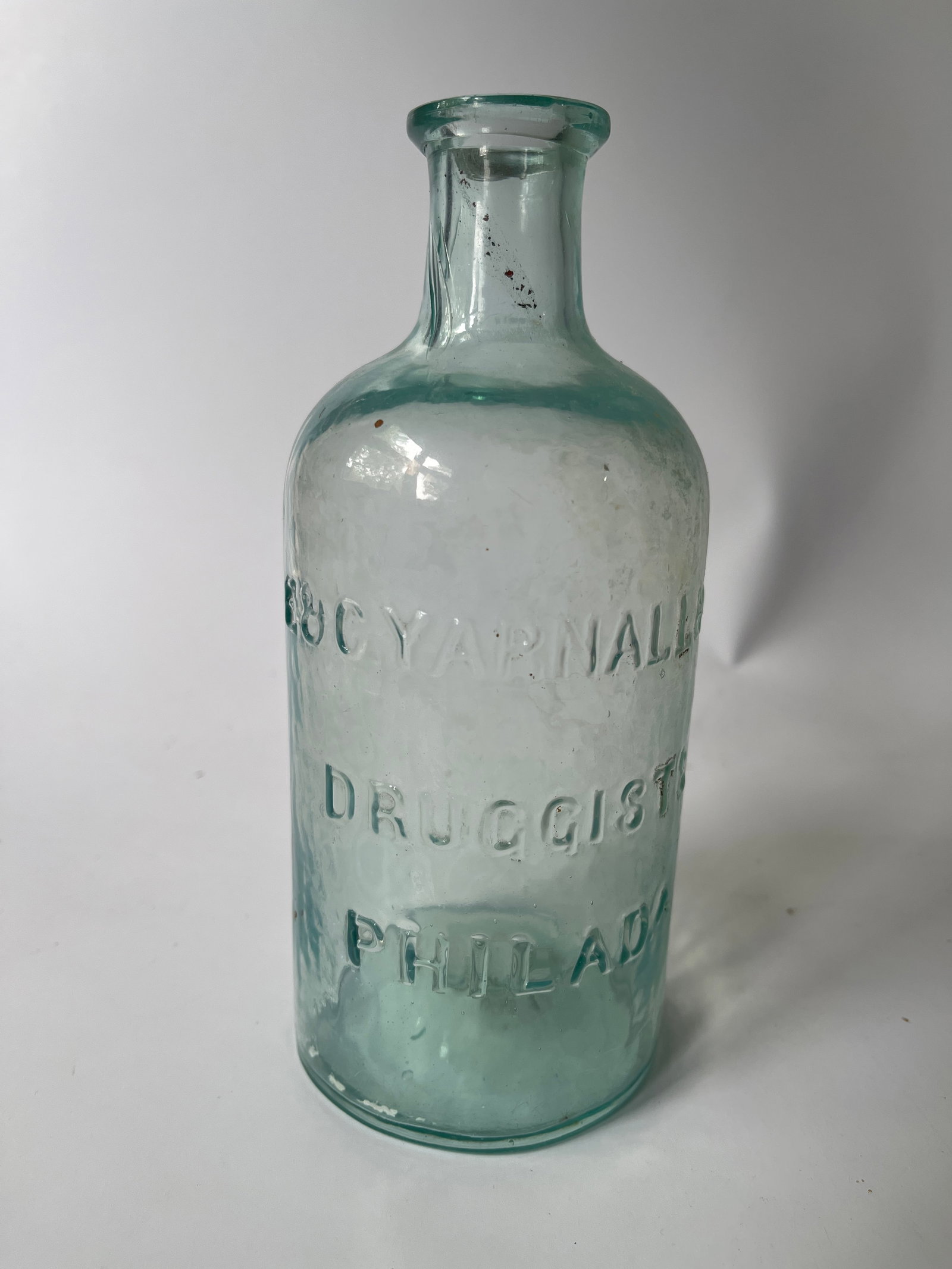 E & G Yarnall & Co Druggists Philada, aqua, open pontil: Here's an early aqua open pontil E&G Yarnall & Co Philada. This bottle stands a little over 7" tall and has no damage. There is some internal stain. This bottle also has nice whittle.