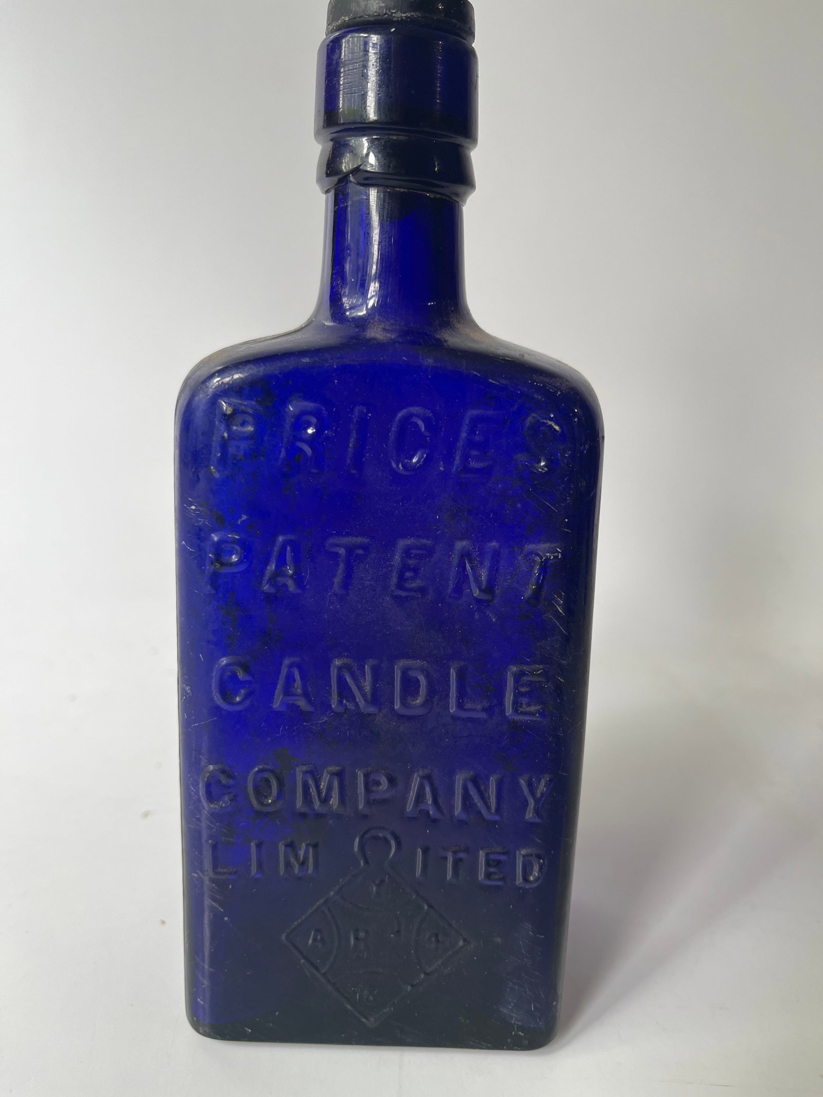 Prices Patent Candle Company Limited, Cobalt blue.: Here's a nice Prices Patent Candle Company bottle in cobalt blue. The bottle has no damage but does have moderate stain. Unusual shape and outstanding color.