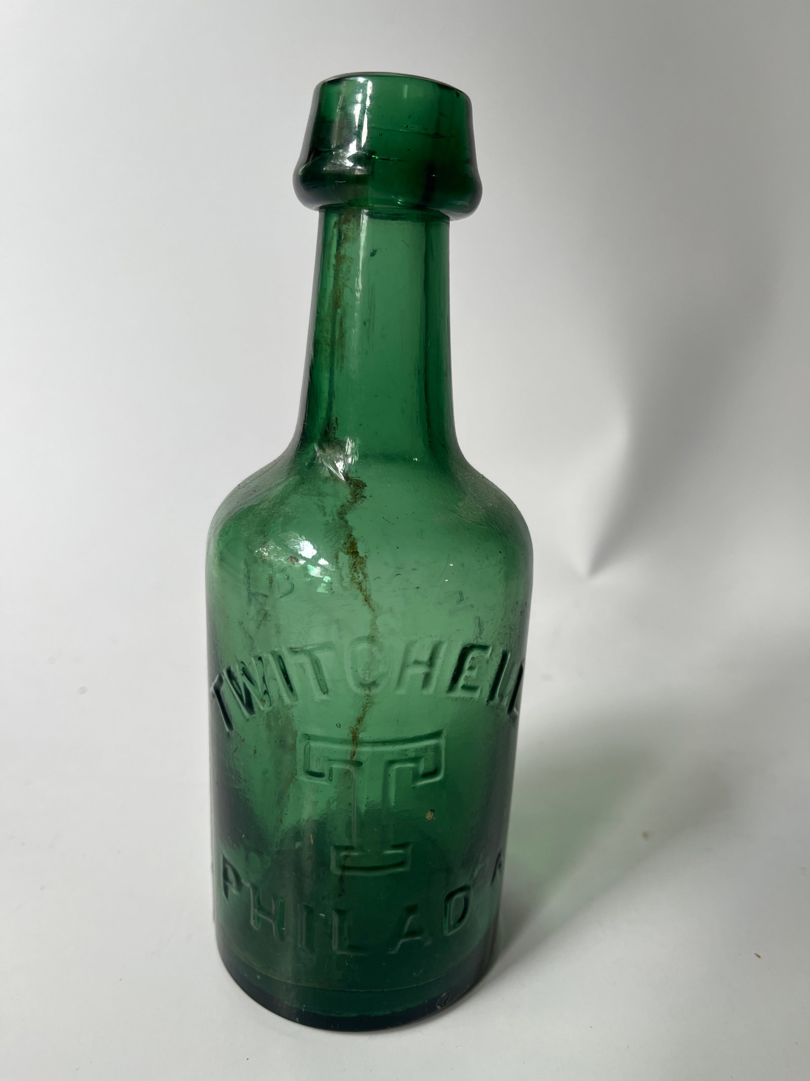 Twitchell T Philada green blob soda: Next we have another blob soda marked Twitchell T Philada on both sides of the bottle. There is no damage and just small amount of internal stain.