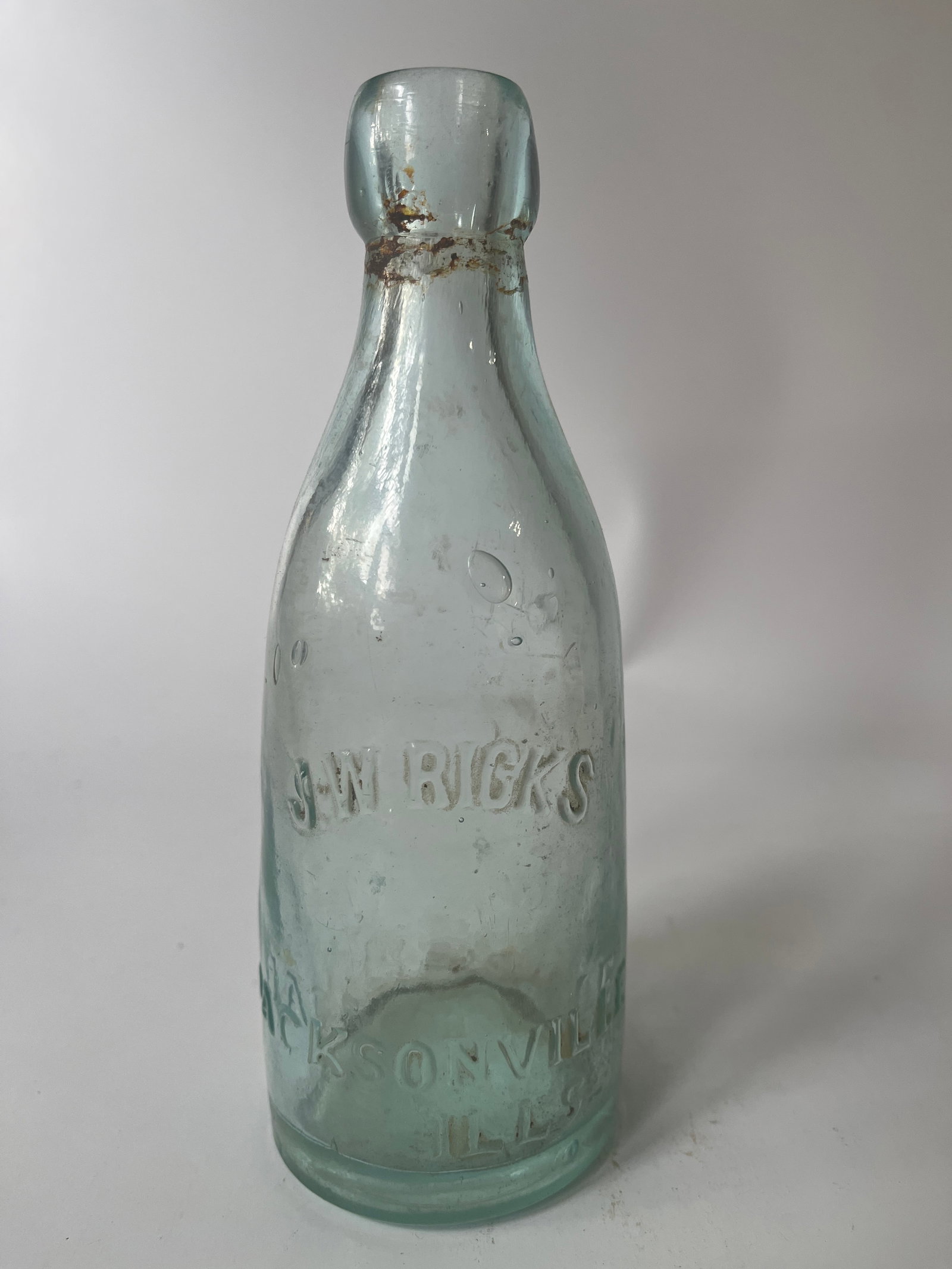 J.W. Ricks Jacksonville, Ills. aqua blob soda: Here's aqua J.W. Ricks Jacksonville, Ills. aqua blob soda. This bottle has no damage and just a light amount of stain.