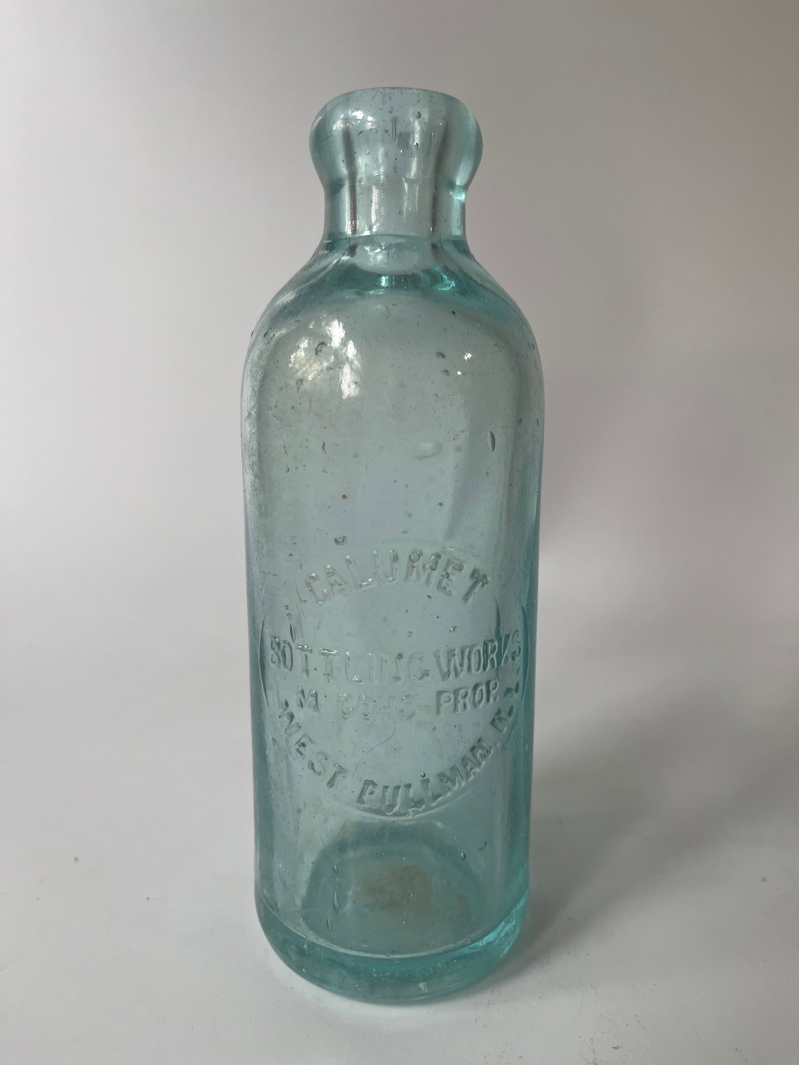Calumet Bottling Works M Cohs Prop West Pullman, Ill hutch soda.: Here's a Calumet Bottling Works M Cohs Prop West Pullman, Ill hutch soda. The bottle has a tiny rough spot on the lip, otherwise no damage. It also has a touch of stain.