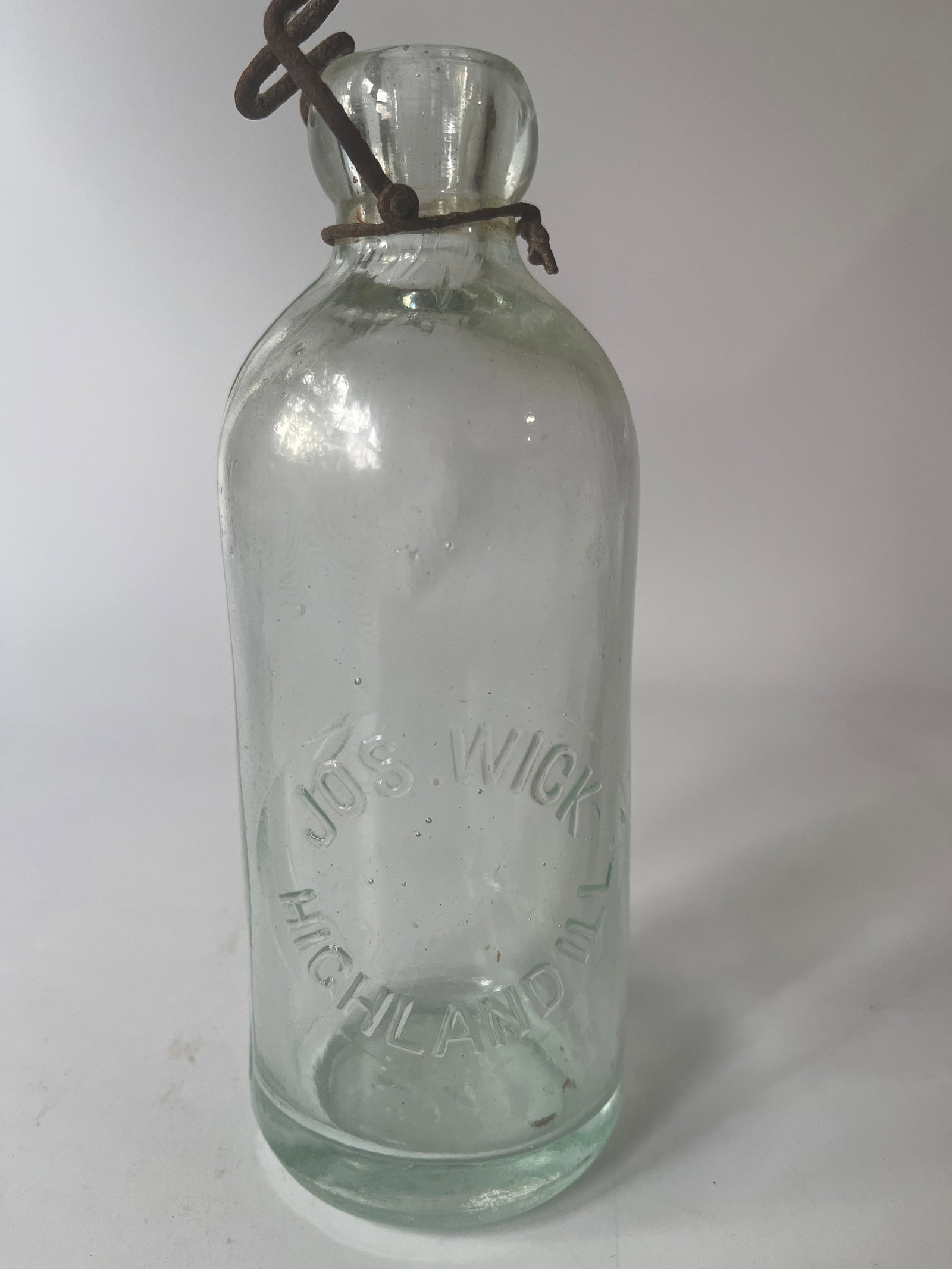 Jos Wick Highland, Ill aqua hutch soda: Here is an aqua Jos Wick Highland, Ill. hutch soda. The bottle has no damage or stain.