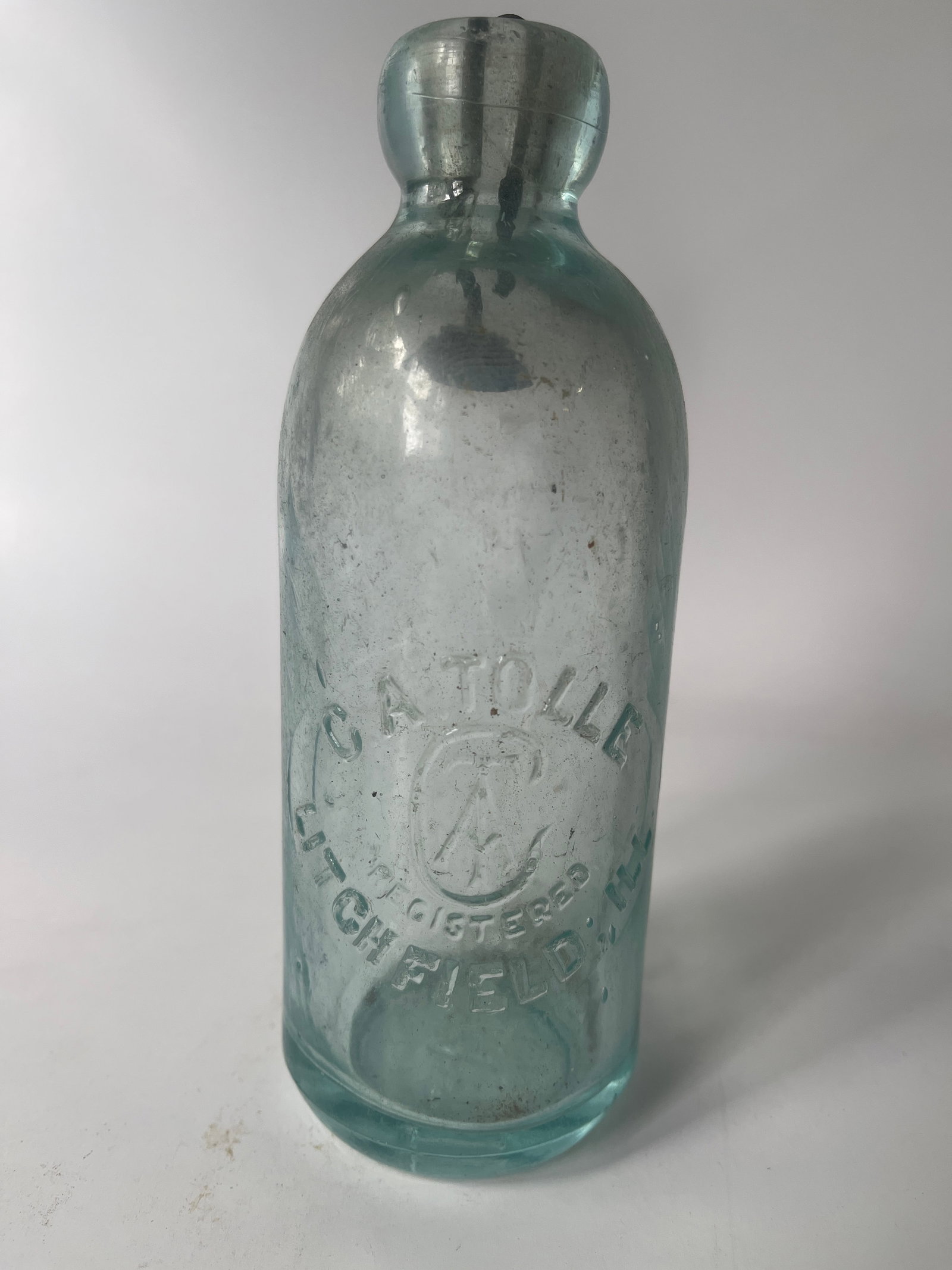 C.A. Tolle Litchfield, Ill. aqua hutch soda.: Here's a C.A. Tolle Litchfield, Ill hutch soda. The bottle is aqua in color and has no damage or stain.