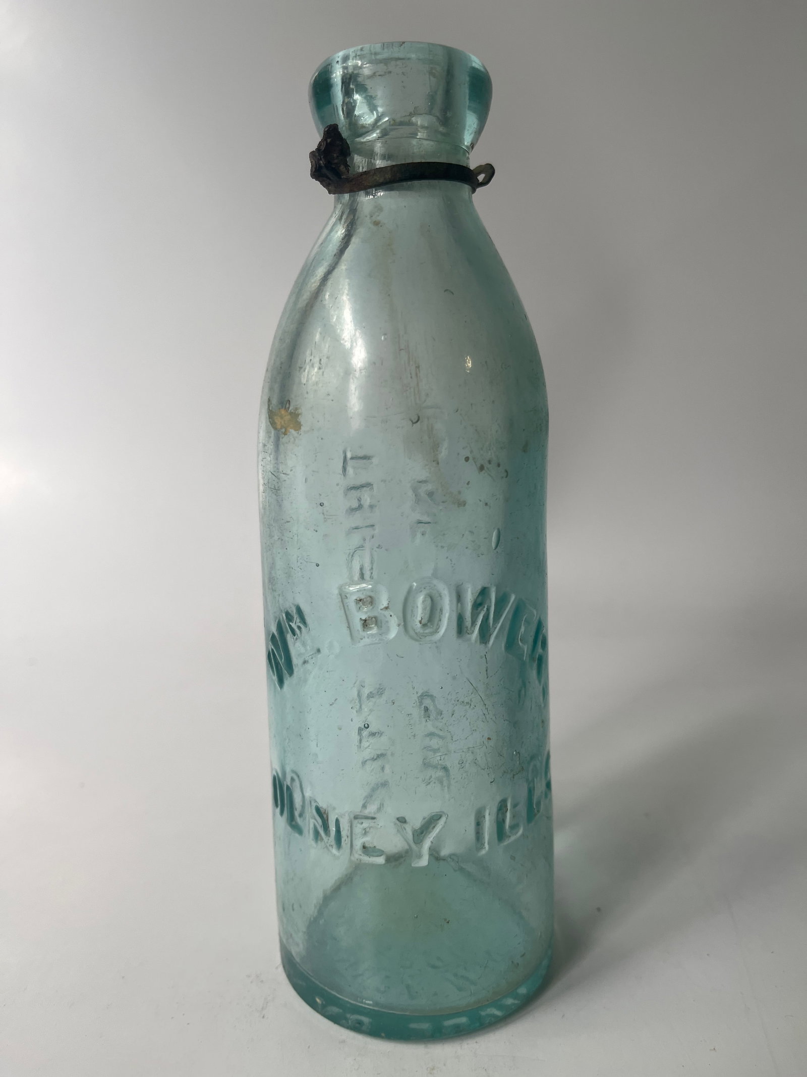 Wm. Bower Olney, Ills gravitating stopper soda: Here's a Wm. Bower Olney, Ills gravitating stopper soda. The bottle is embossed on the base Gravitating Stopper Made by John Matthews 1864 New York. The bottle is aqua in color with no damage or stain