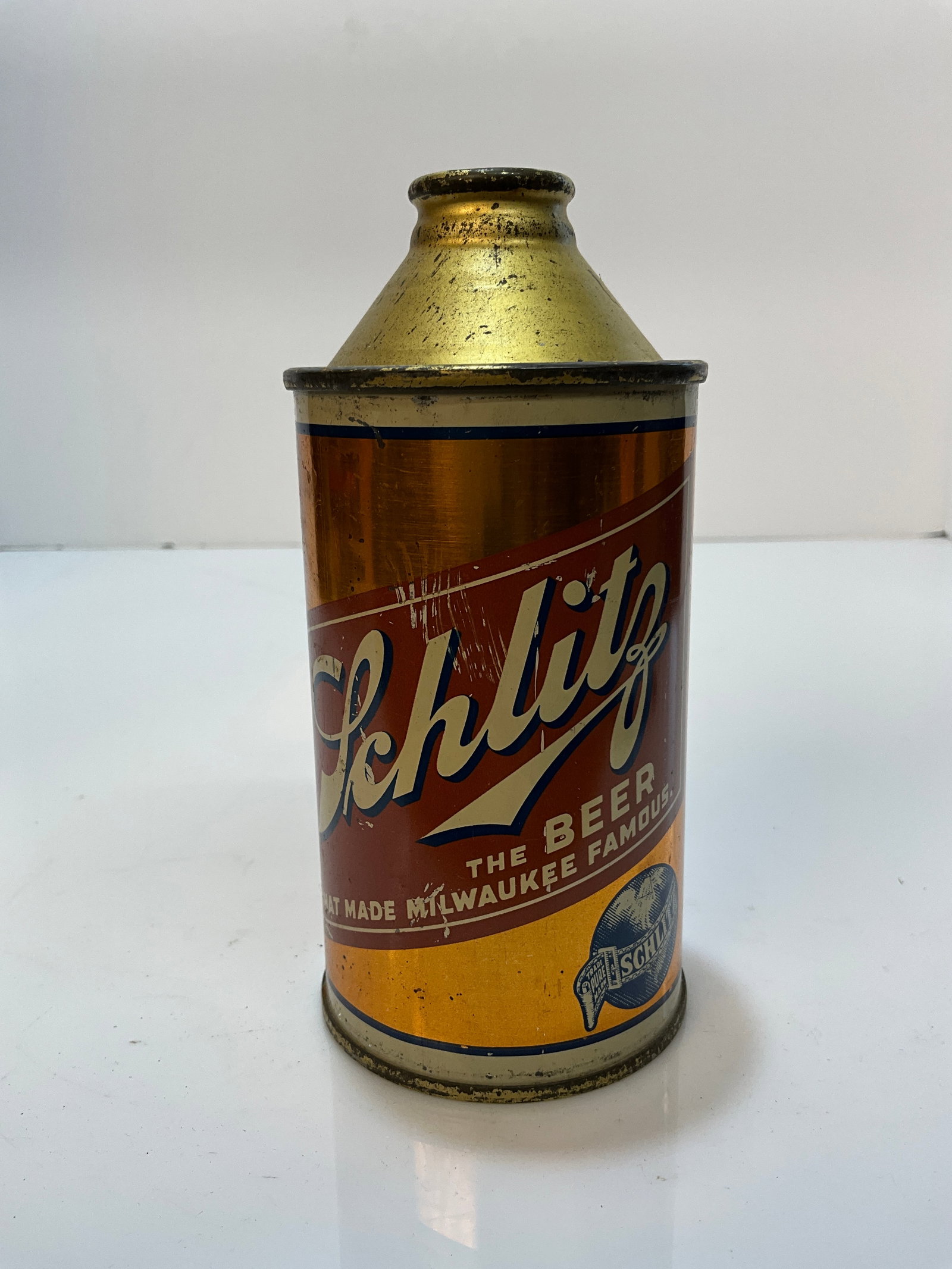 Schiltz Cone Top Beer Can, The Beer That Made Milwaukee Famous, Wisconsin: Schiltz Cone Top Beer Can, The Beer That Made Milwaukee Famous, Wisconsin. A gold or bronze colored beer with the Schlitz Label right across the front of it. A nice can that retains a lot of its origi