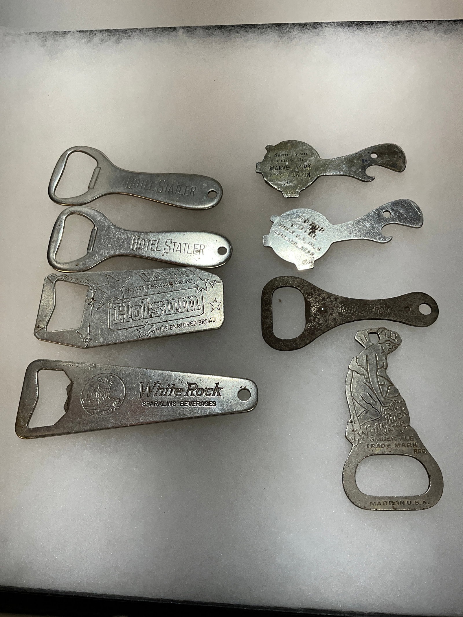 Eight Early Figural Advertising Openers in various shapes: Eight Early Figural Advertising Openers in various shapes1. Holsum Bread, Bottle opener. 2. Opener in the shape of a Turtle - Motor Motel - Hi-Way US No.6, Ashland, Nebr. 3. Opener in the shape of a T