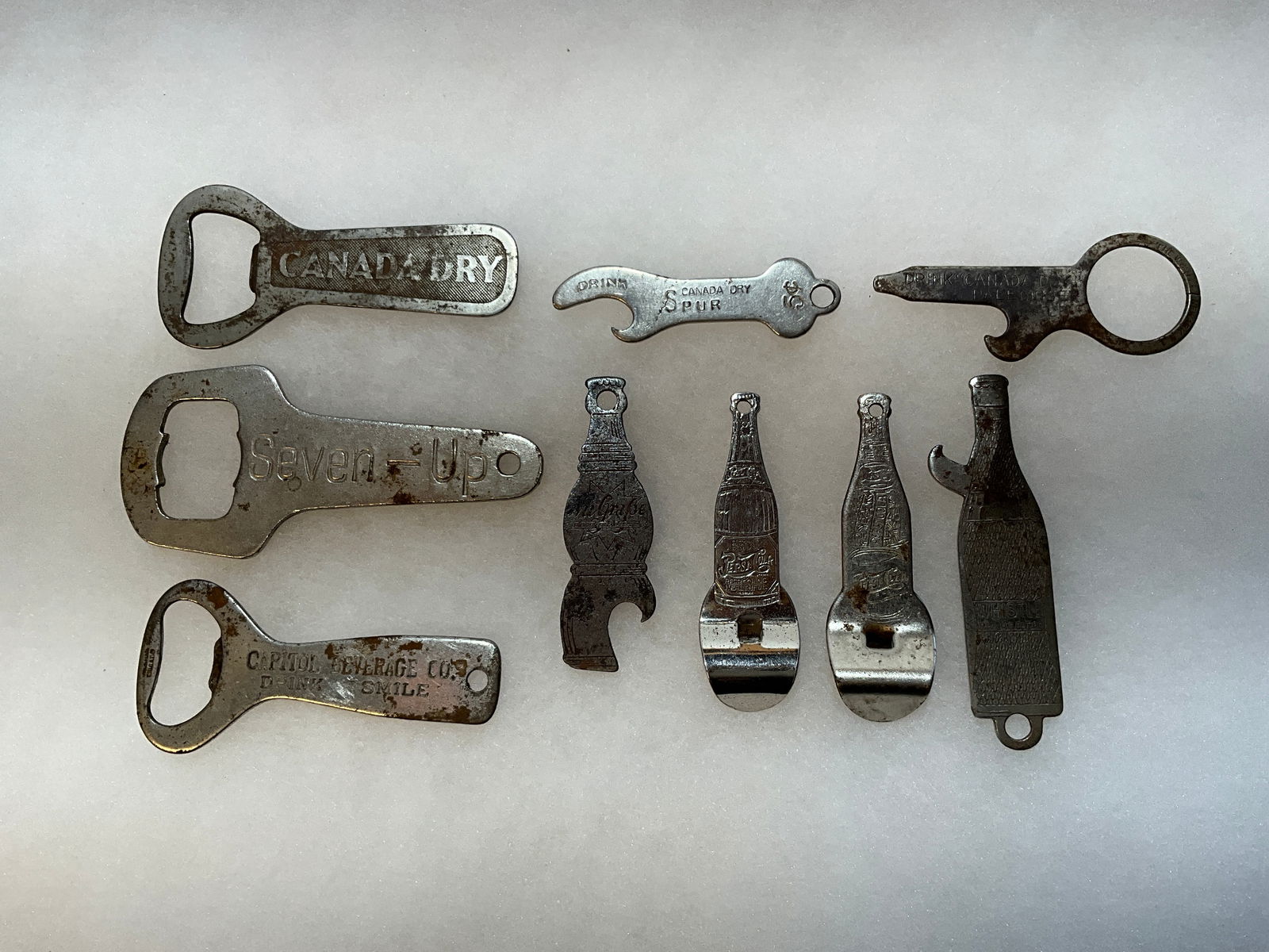 Nine Early Figural Advertising Soda Pop - Openers in Various Shapes (1 of 6)