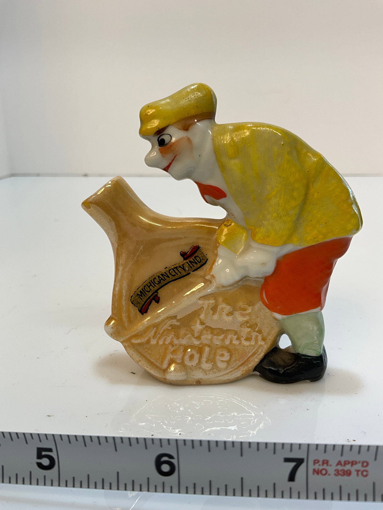 Vintage Whiskey Nip - The Nineteeth Hole - Michigan City Indiana - Made in Japan: Vintage Whiskey Nip - The Nineteeth Hole - Michigan City Indiana - Made in Japan. This Nip is of a man golfing and advertising the town of Michigan City Indiana. No damage and no cap