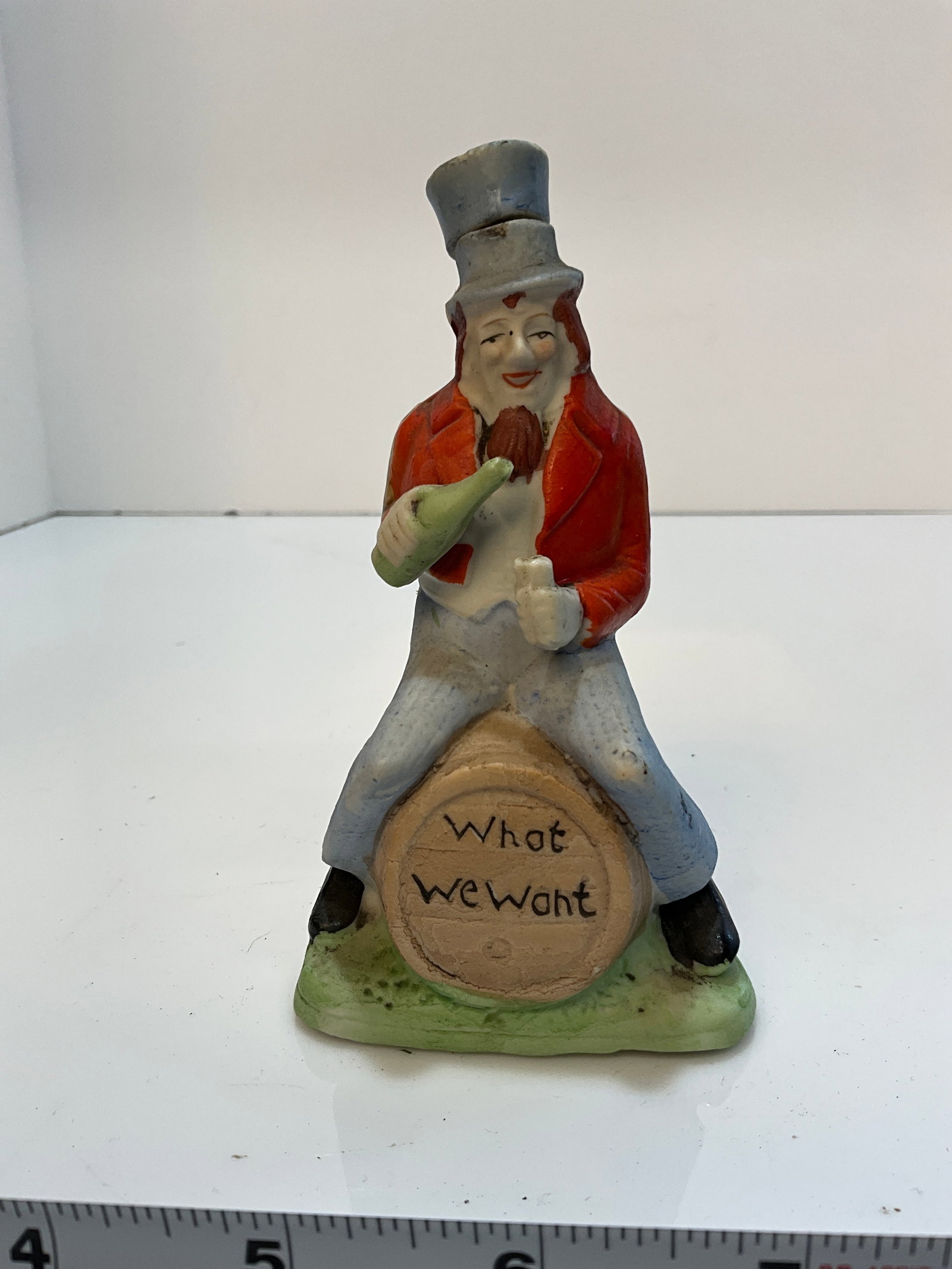 Vintage Whiskey Nip - Uncle Sam on a Barrel, Drinking "What we Want" - Made in Japan.: Vintage Whiskey Nip - Uncle same on a Barrel, Drinking - Made in Japan. An interesting whisk Nip, reads "What we Want"