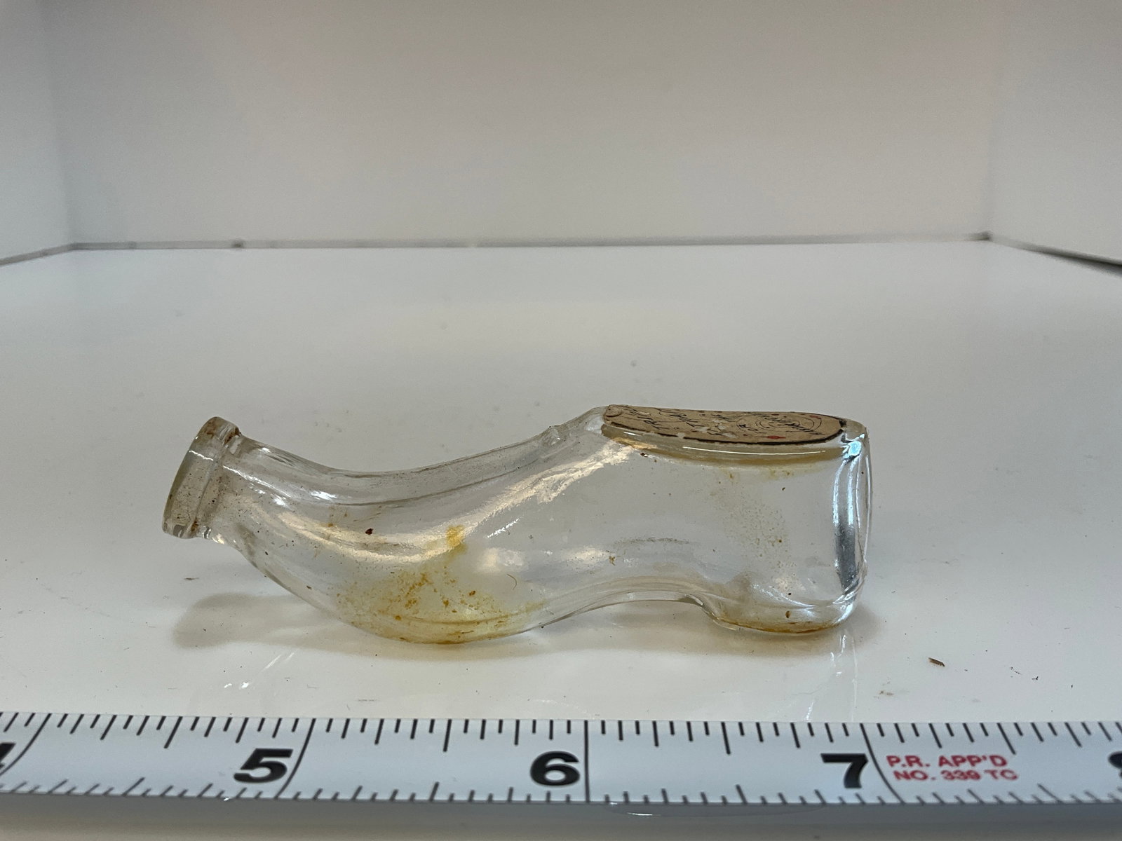 Whisky Nip in the shape of a shoe - Label Reads - Triple Extrait for the Handkerchief: Whisky Nip in the shape of a shoe - Label Reads - Triple Extrait for the Handkerchief
