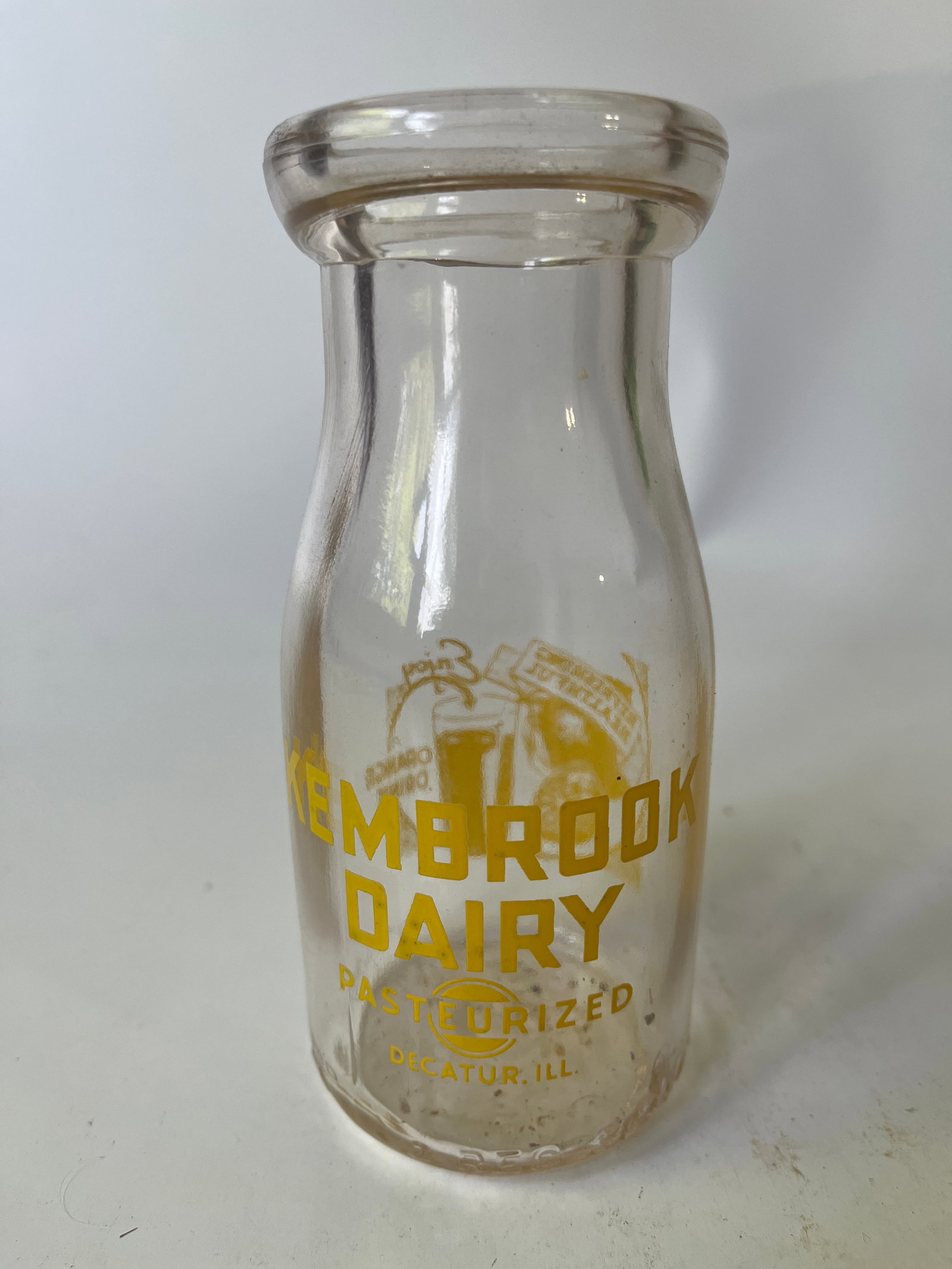 Kembrook Dairy Decatur, Ill yellow pyro half pint orange juice.: Here's a Phillip's Dairy Co. Decatur, Ill. Yellow pyro half pint bottle. The bottle has no damage or stain.
