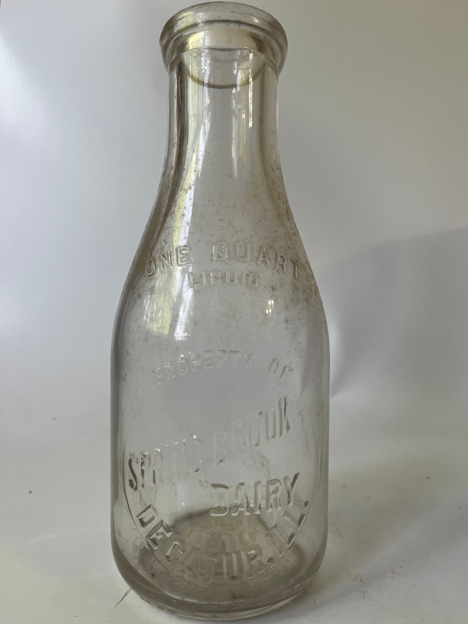 Spring Brook Dairy Decatur, Ill quart embossed milk bottle. (1 of 4)