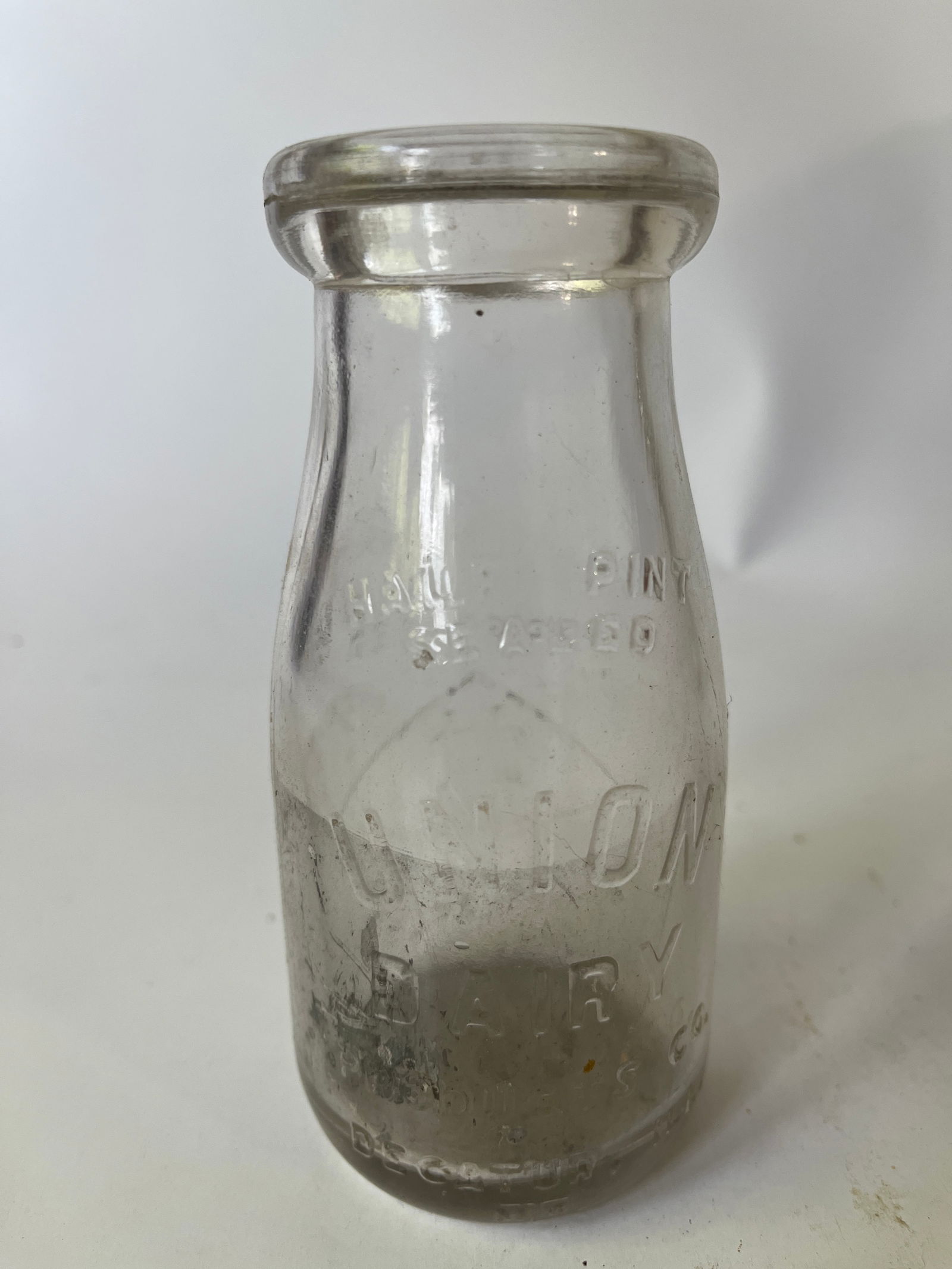 Union Dairy Products Decatur, Ill embossed half pint milk bottle. (1 of 5)