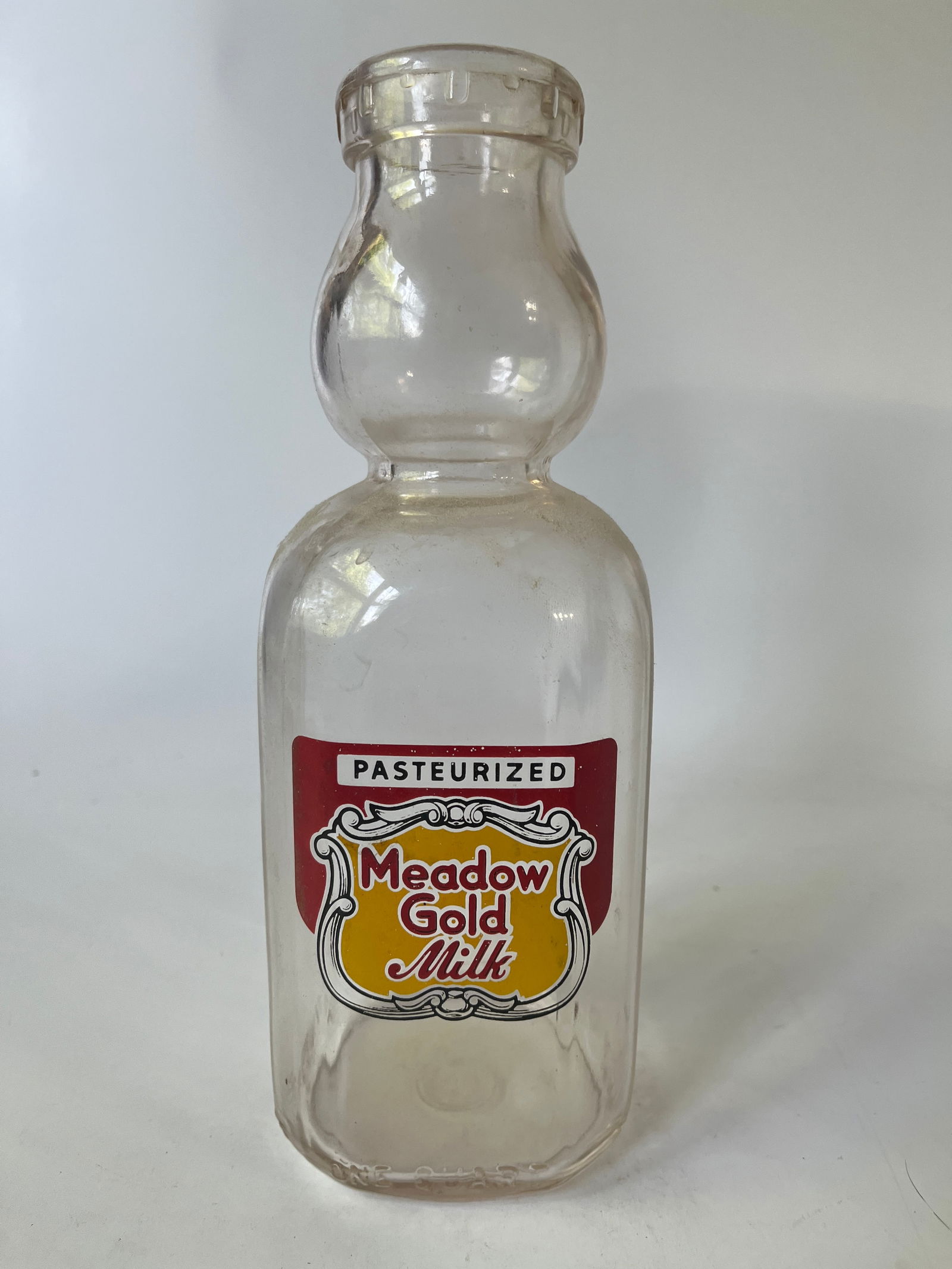 Meadow Gold Milk red and yellow pyro quart milk bottle. (1 of 3)