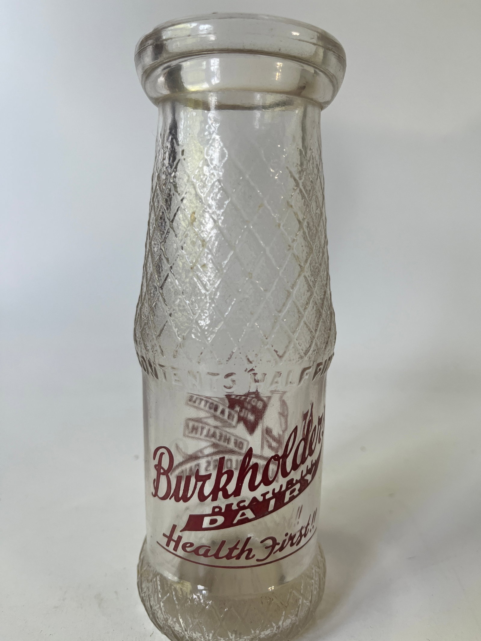 Burkholder's Decatur Dairy brown pyro half pint milk or juice bottle.: Here's a Burkholder's Decatur Dairy brown pyro half pint milk or juice bottle. The bottle has no damage or stain.