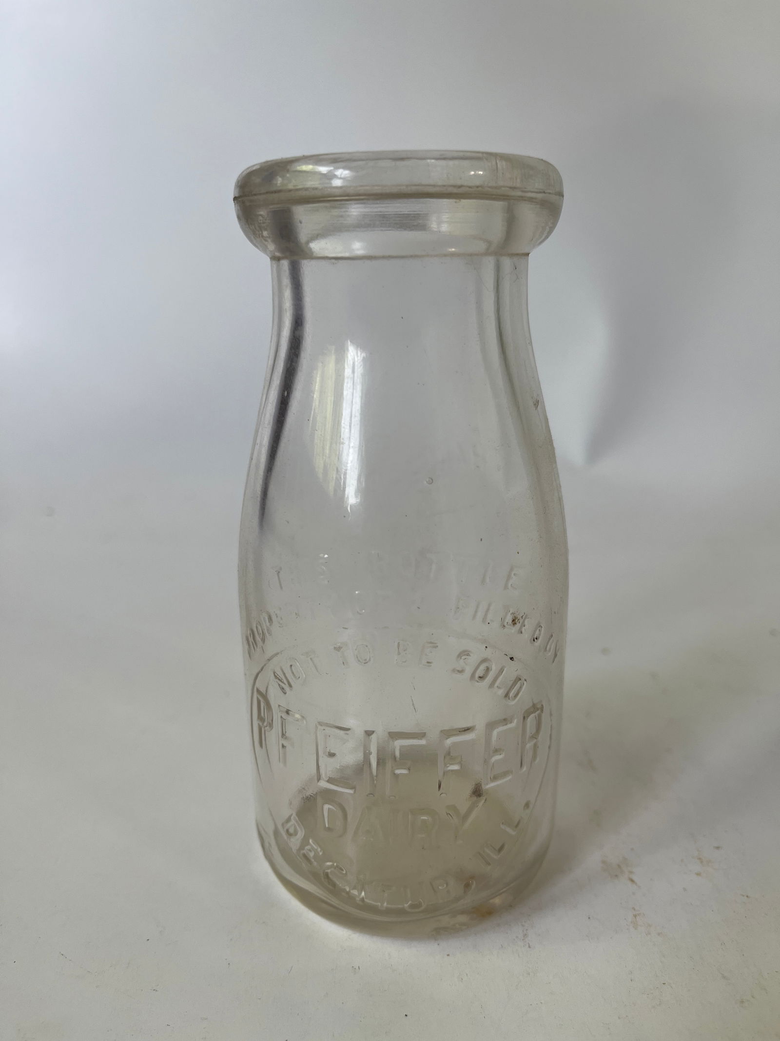Pfeiffer Dairy Decatur, Ill embossed half pint milk bottle. (1 of 4)