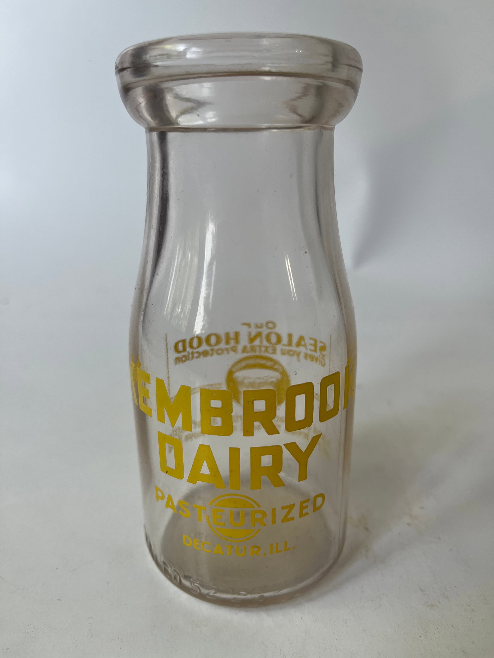 Kembrook Dairy Decatur, Ill yellow pyro half pint milk.: Here's a Kembrook Dairy Decatur, Ill yellow pyro half pint milk. The bottle has no damage or stain.