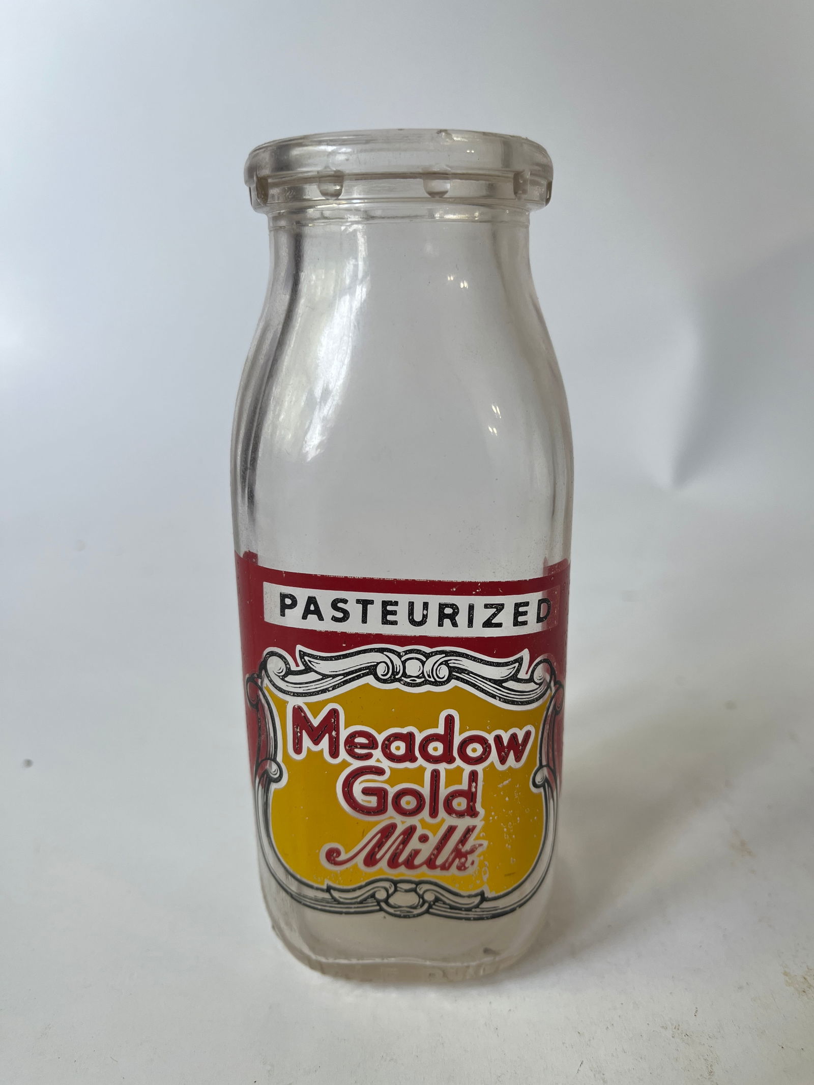 Meadow Gold Milk red and yellow pyro half pint milk bottle. (1 of 3)