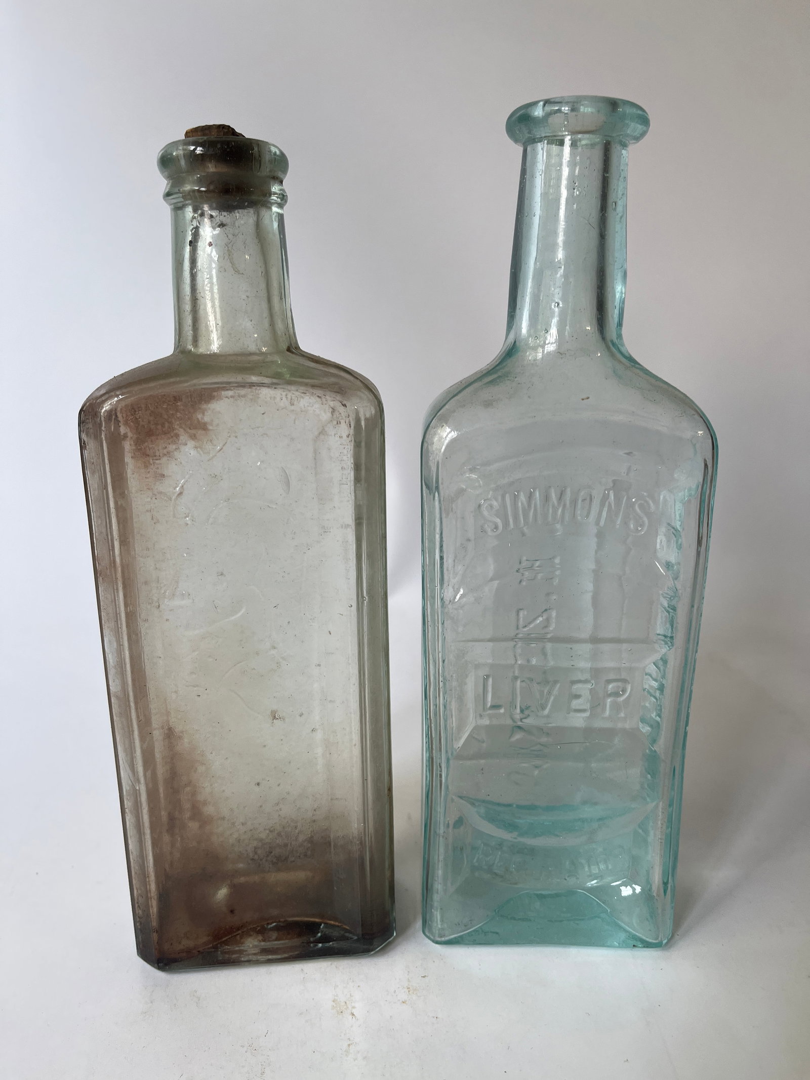 Lot of 2 meds- Simmons Liver Reg & Indian Sagwa.: Here’s a lot of 2 meds-Simmons Liver Regulator and Healy & Bigelow Indian Sagwa w/ embossed Indian. Both are aqua and have no damage. They could use a bath.