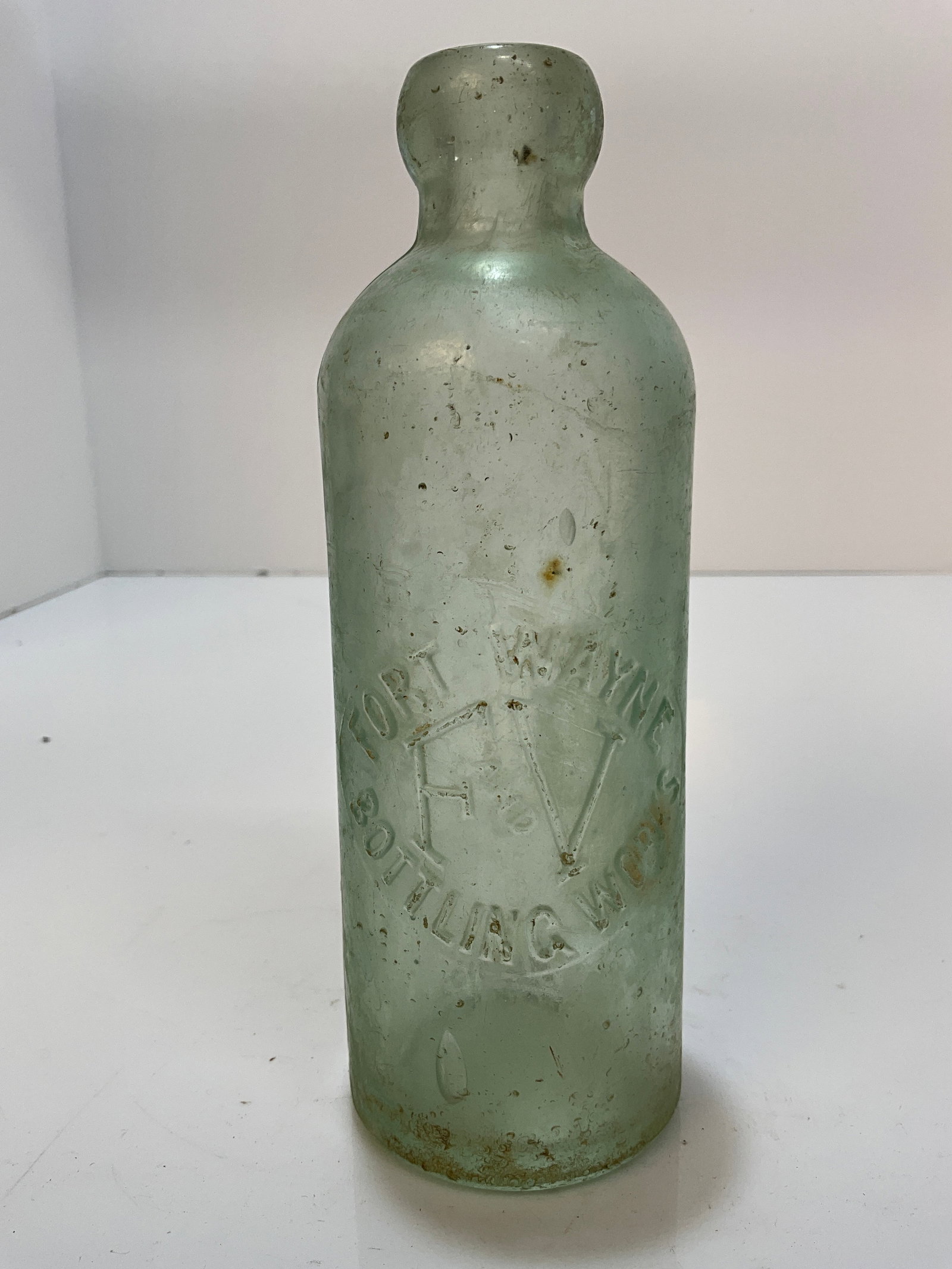 Fort Wayne bottling Works, F. And V. In a round slug plate Hutchinson.: Fort Wayne bottling Works, F. And V. In a round slug plate Hutchinson. Bottle needs a good cleaning, but appears to be damaged free